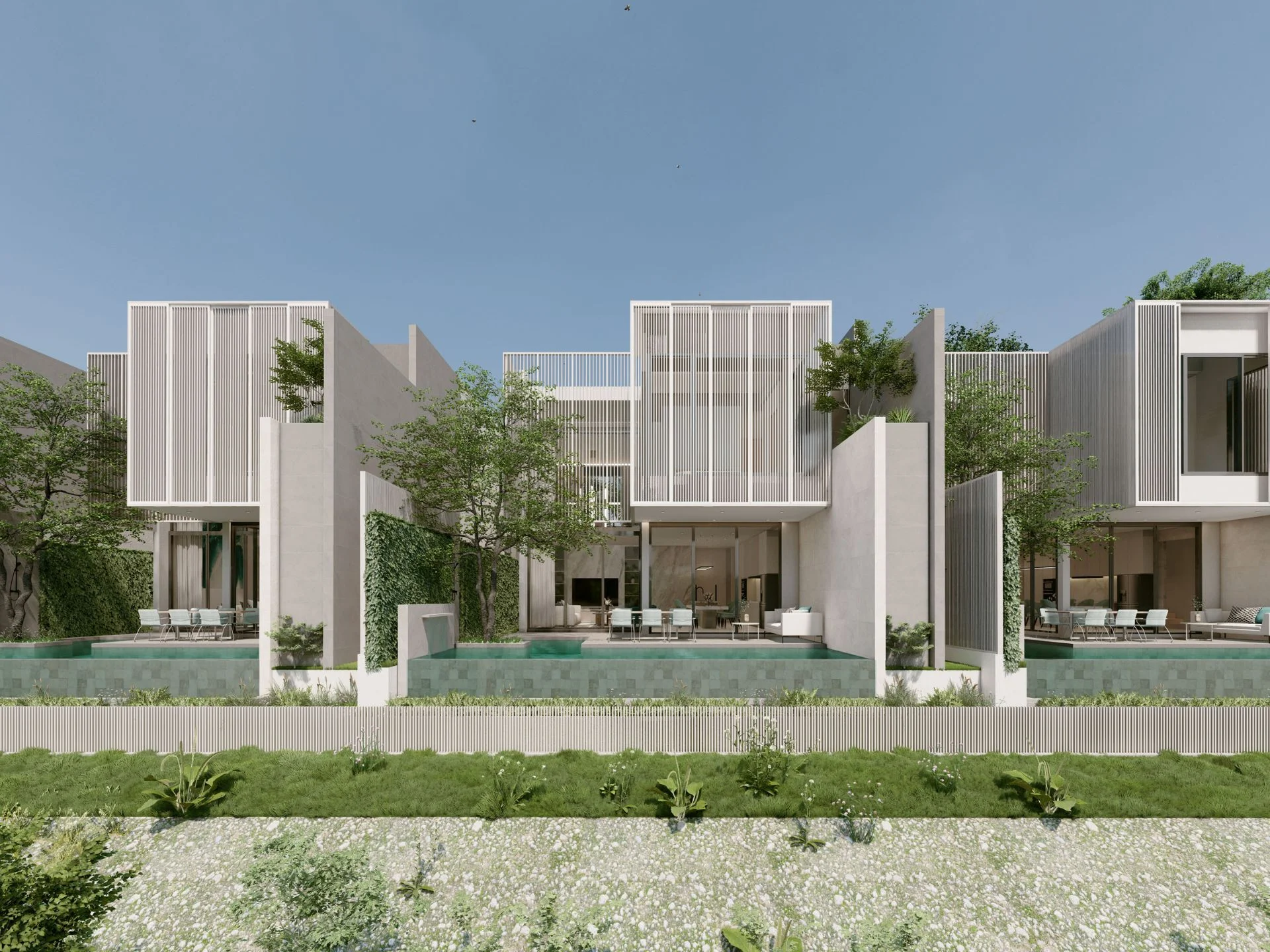Architecture of Larimar Villas with modern white facades and integrated landscaping, Thailand