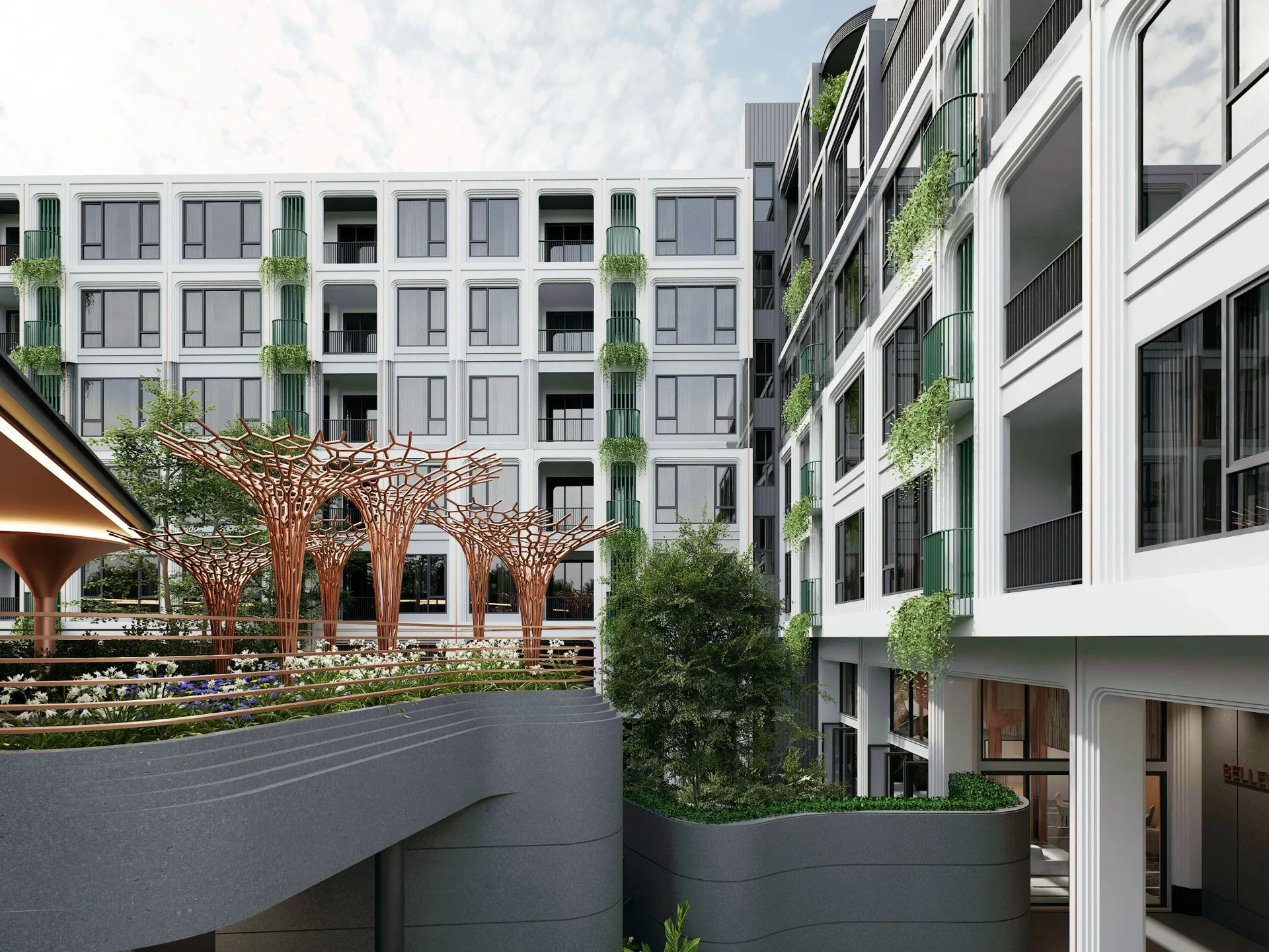 Landscaped courtyard with sculptural trees at Bellevue Lagoon, Thailand