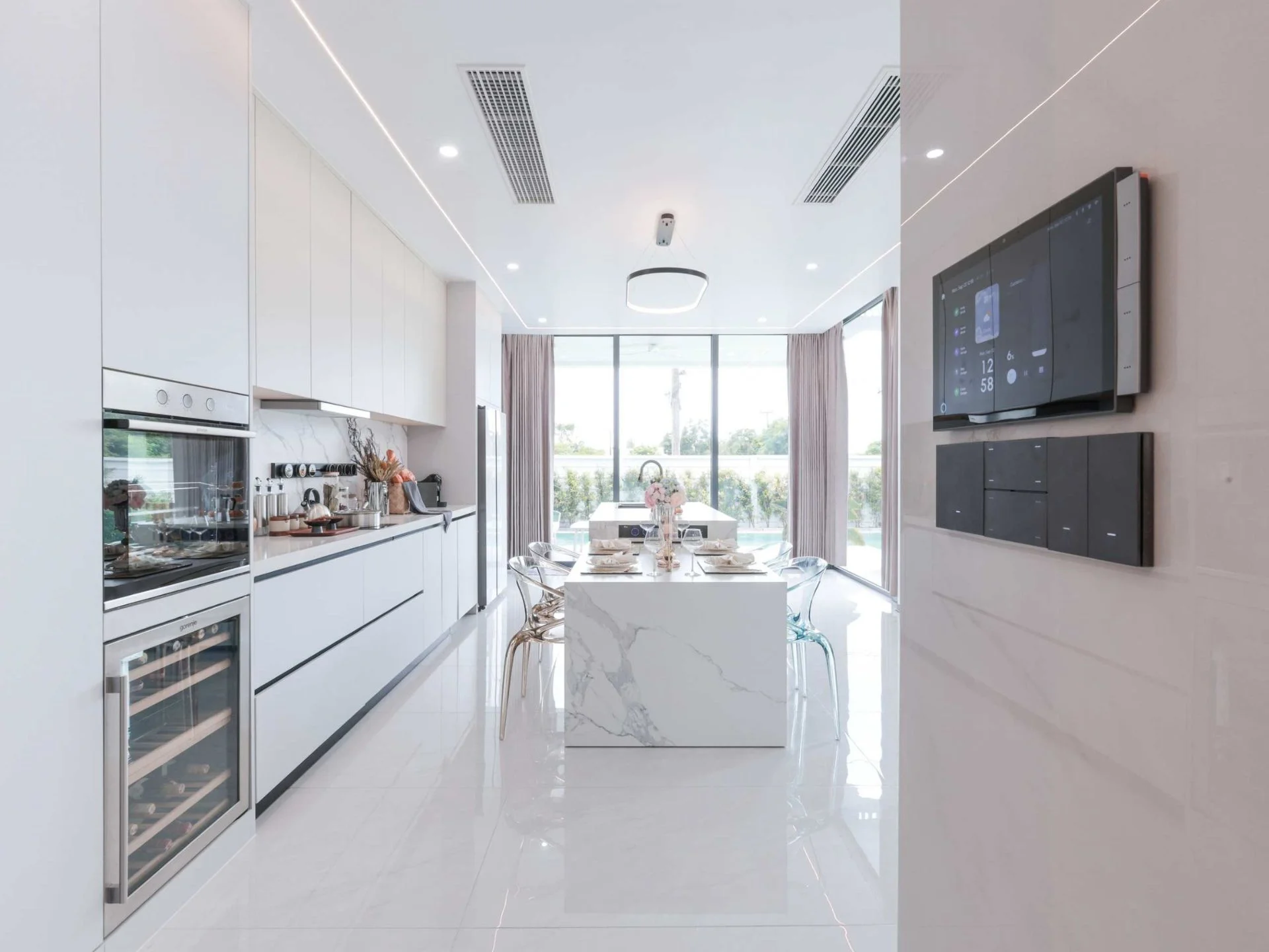 Kitchen and dining area interior with pool view at Larimar Villas, Thailand