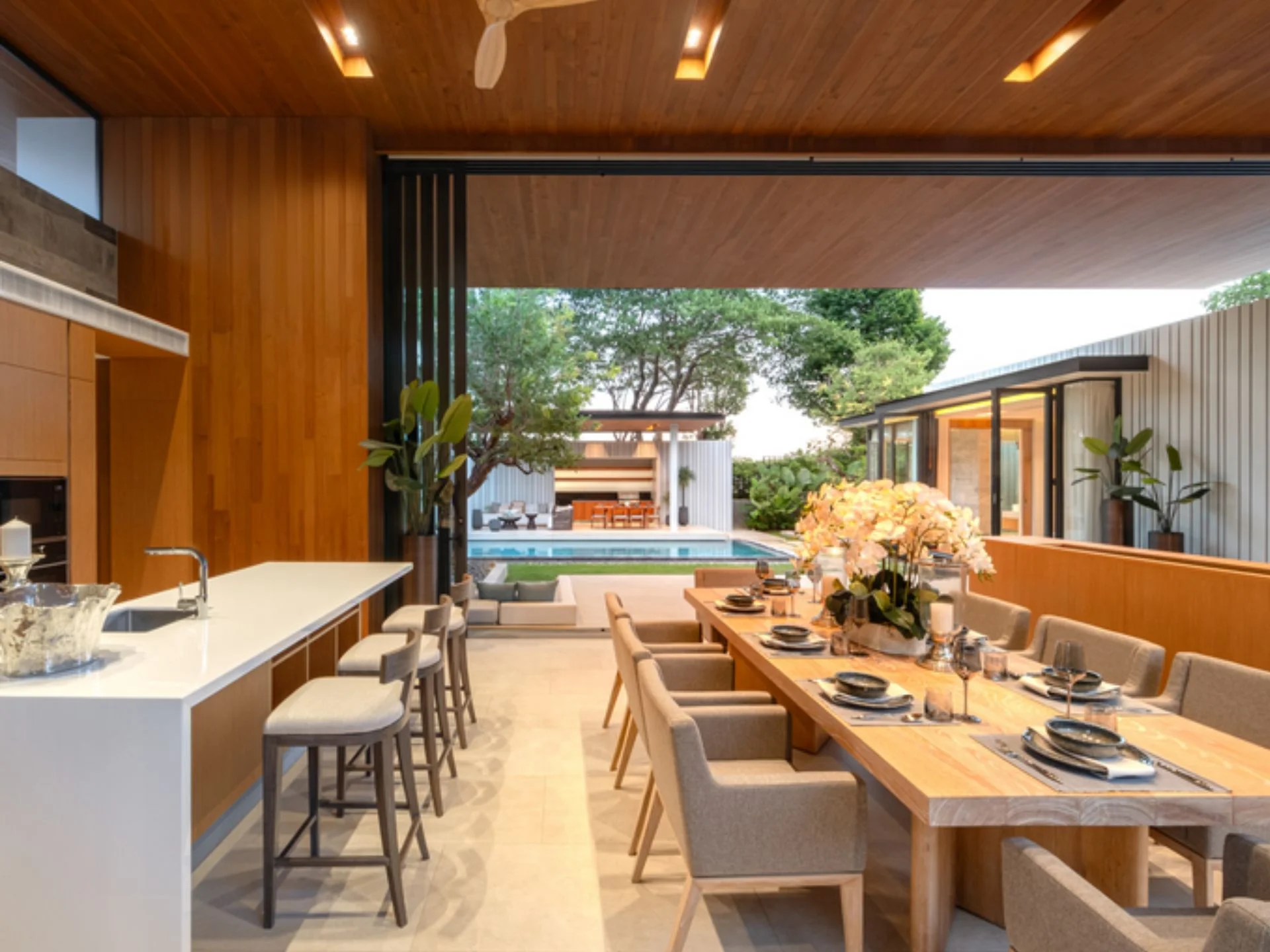 Open-plan kitchen and dining area with pool view at Botanica Majestia, Thailand