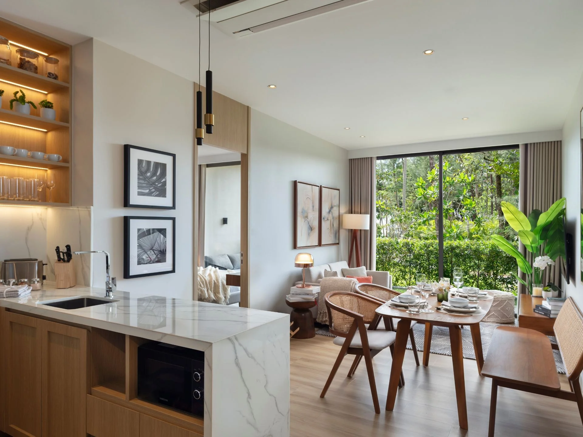 Open-plan kitchen and dining area in 1-bedroom apartment at SUDARA, Thailand