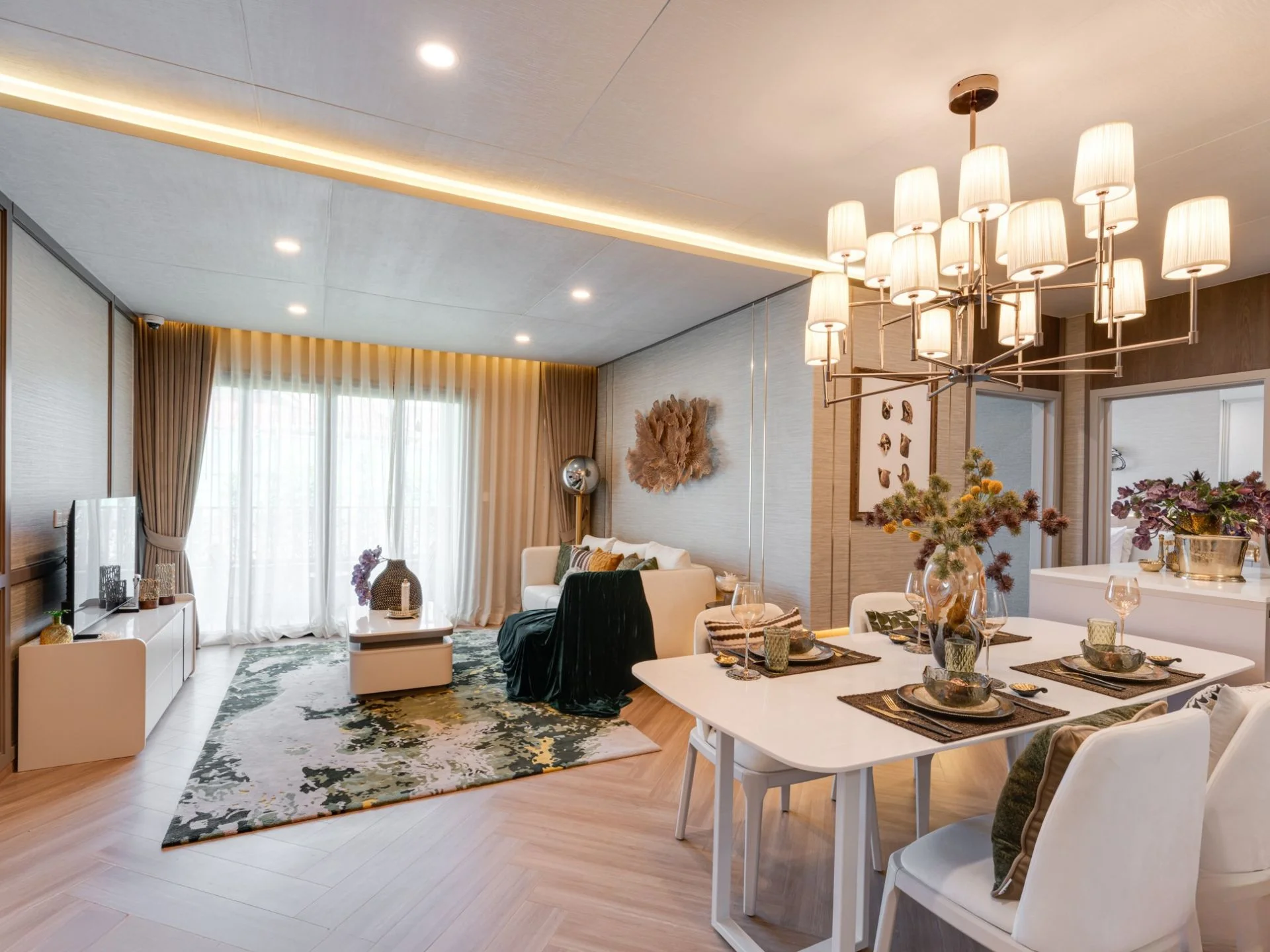 Open-plan living and dining area interior in 3-bedroom penthouse at The Title Coralina, Kamala