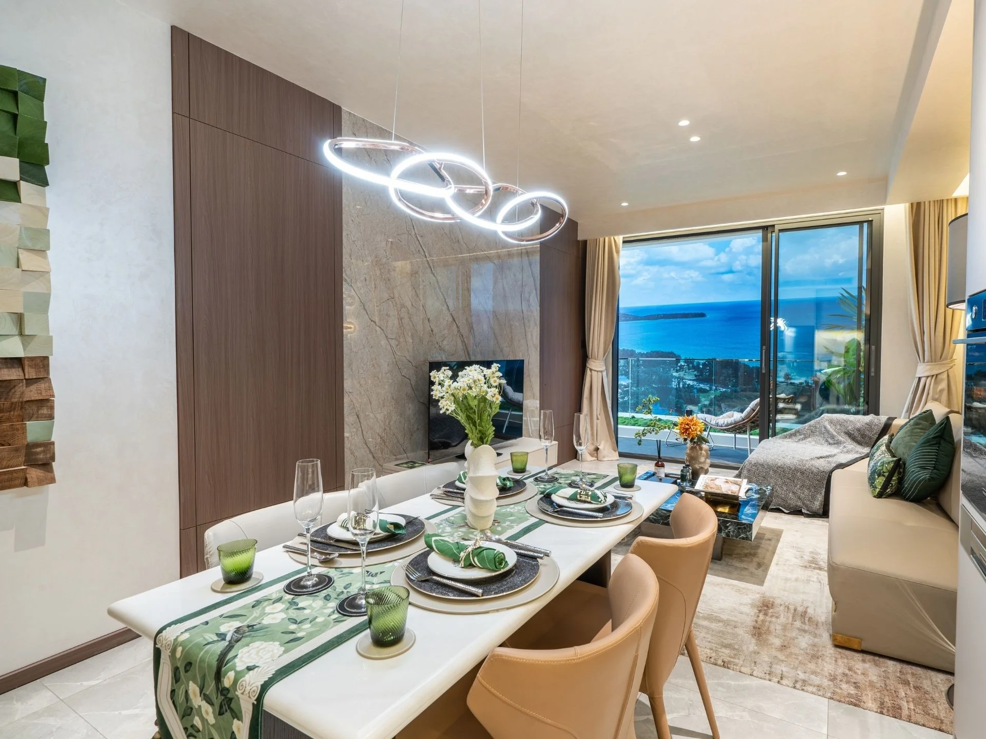 Open-plan dining and living area with sea view in 2-bedroom apartment at AYANA Heights, Bang Tao