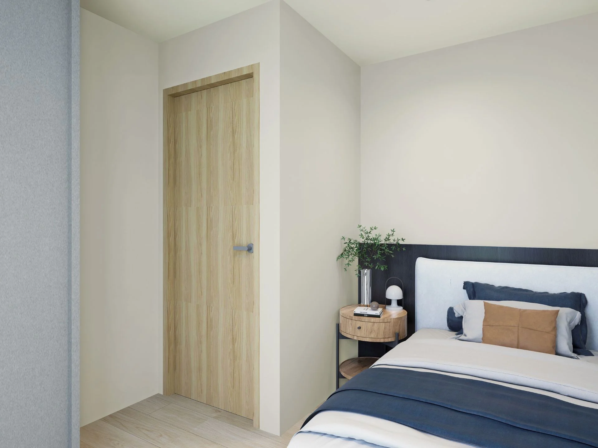 Bedroom interior with wooden door and nightstand in Sea Heaven Nai Thon studio, Thailand