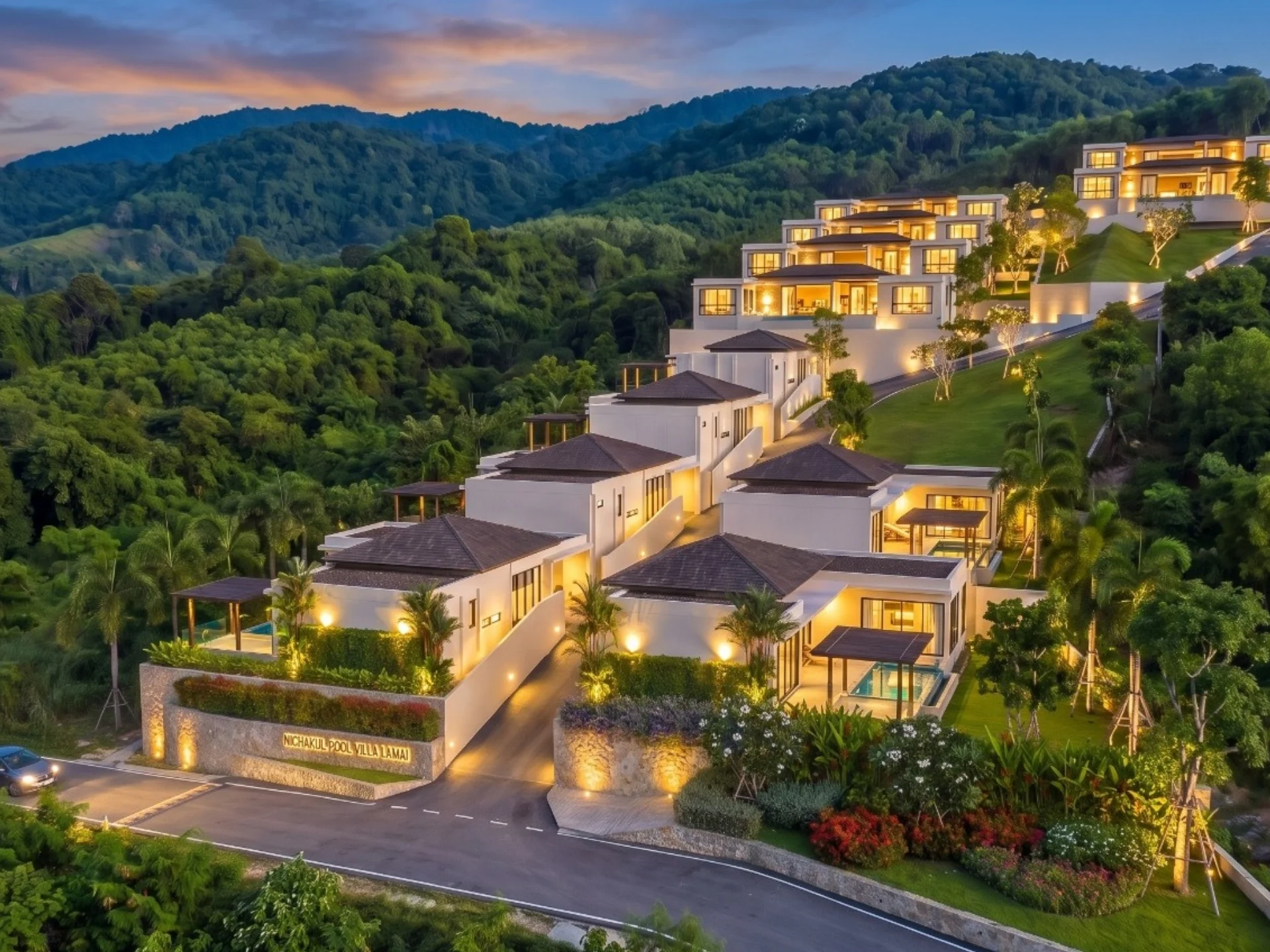 Hillside villa complex architecture with mountain views at dusk, Lamai, Thailand
