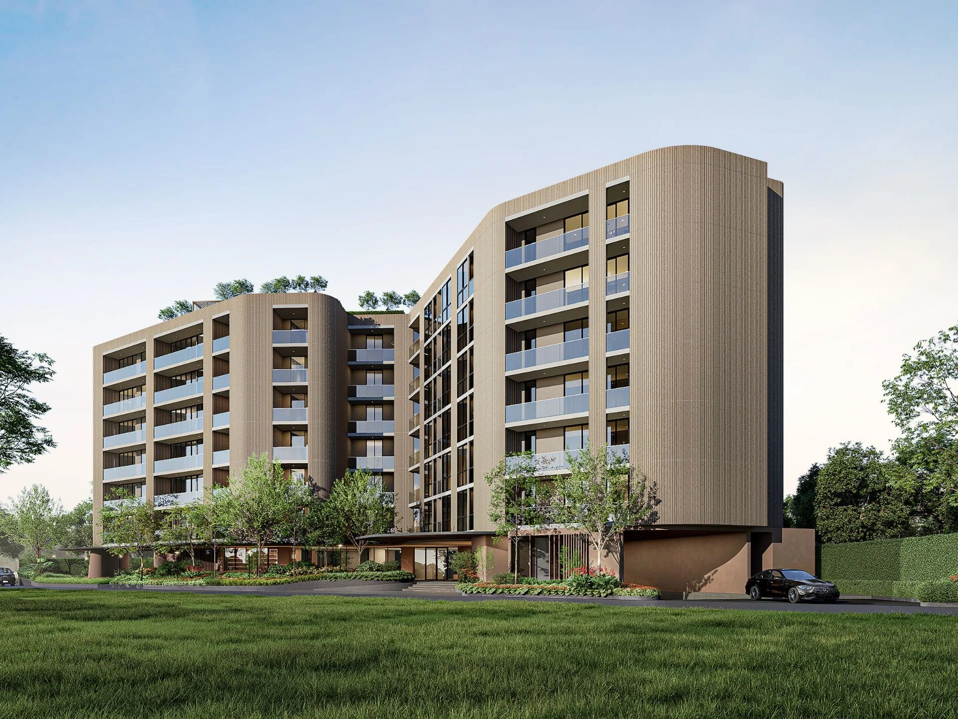 Modern residential complex architecture with curved facade and landscaping, Bang Tao