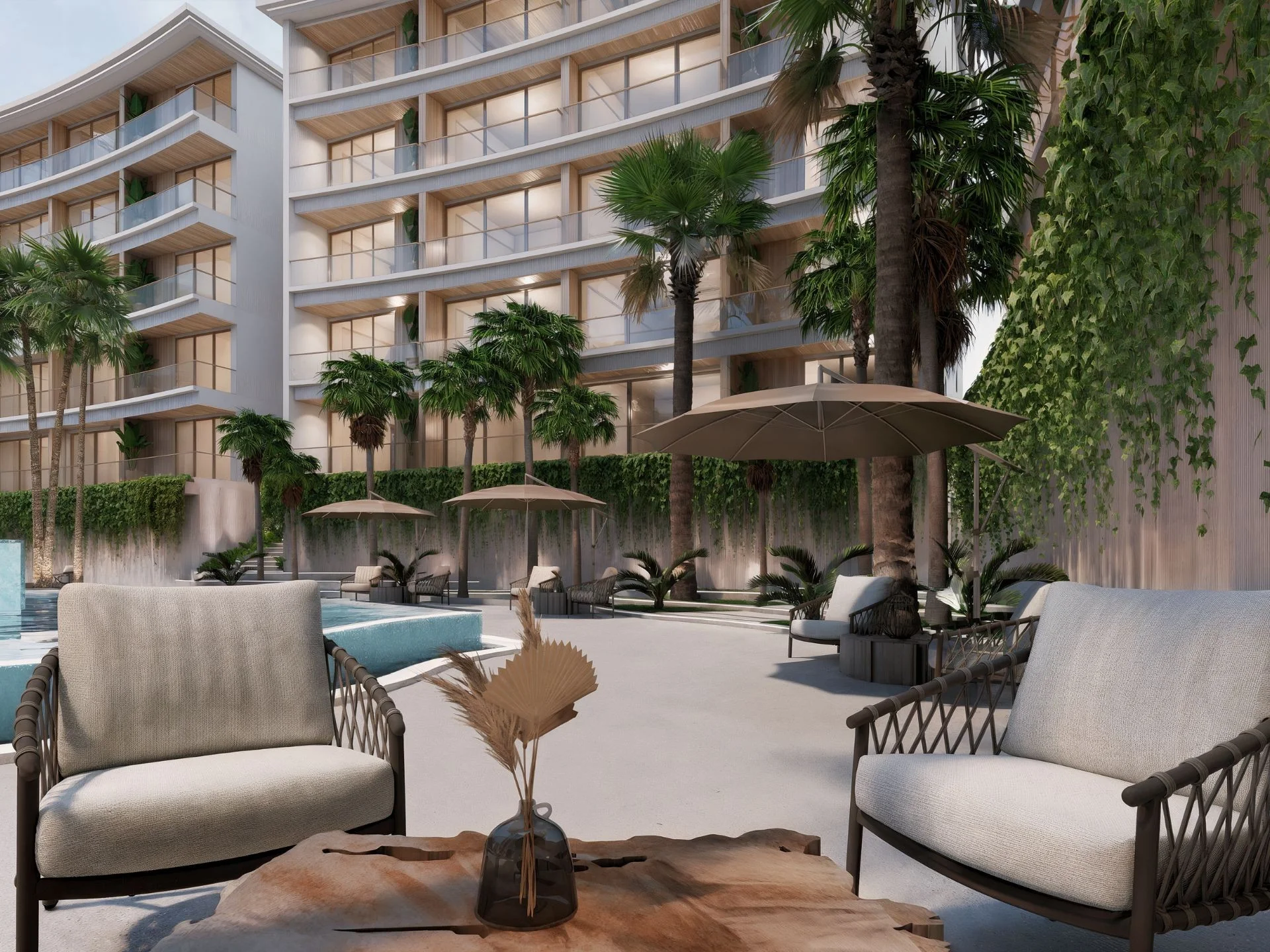 Landscaped courtyard with seating area at The Trees Residence, Bang Tao