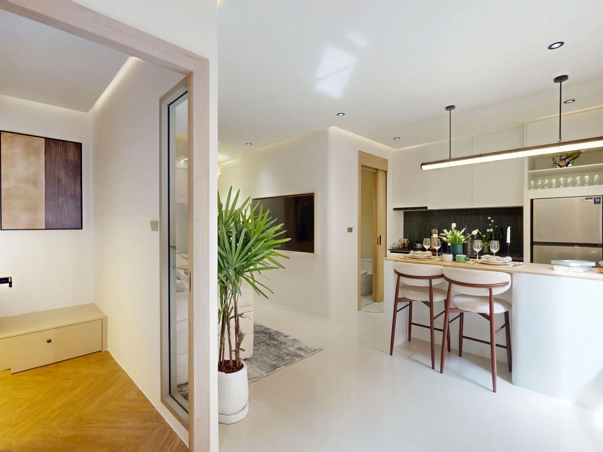Open-plan kitchen and living area interior in 2-bedroom apartment at The Trees Residence, Bang Tao