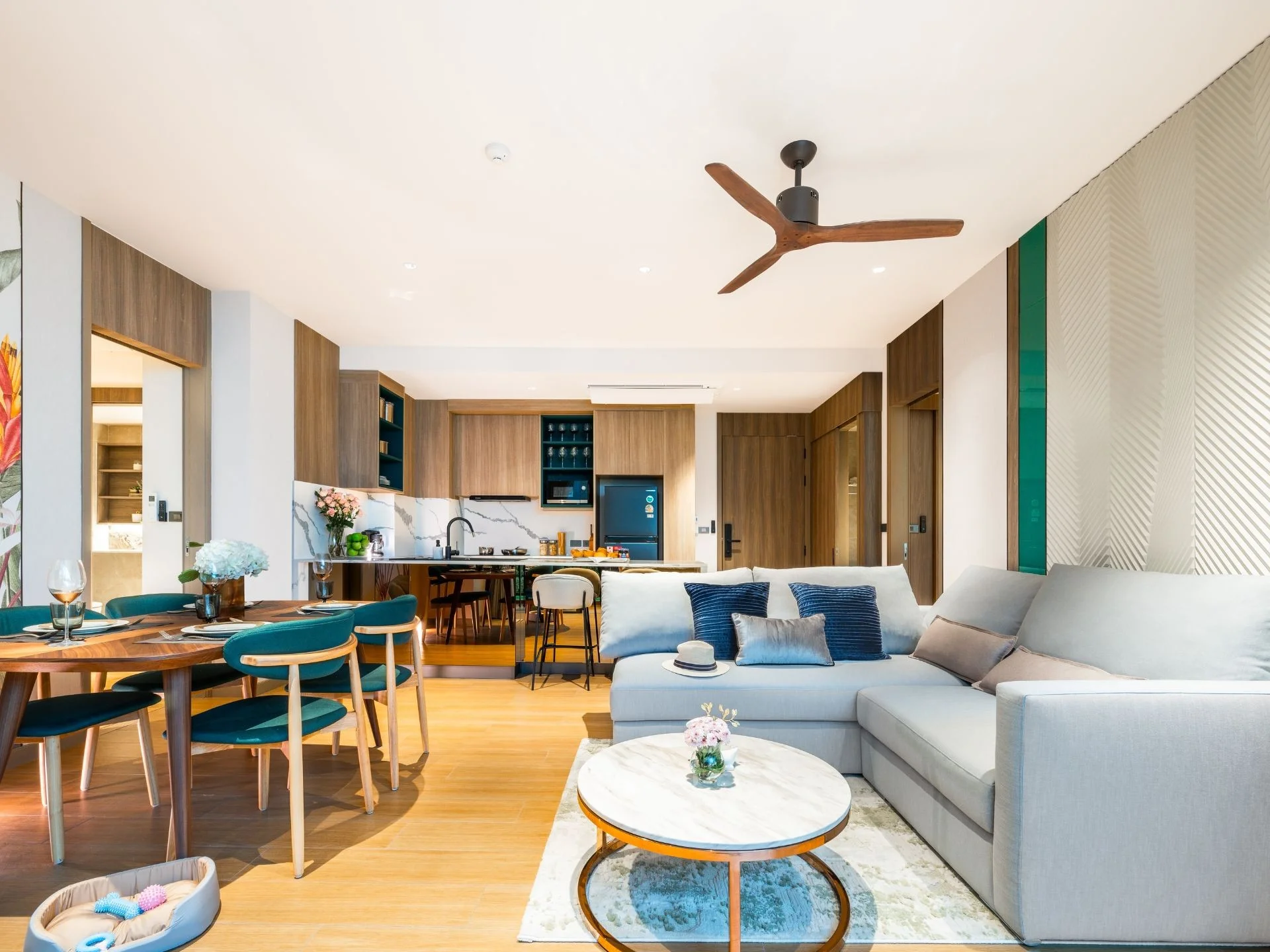 Open-plan living and dining area with kitchen in 2-bedroom apartment at Laguna Skypark Elara, Bang Tao