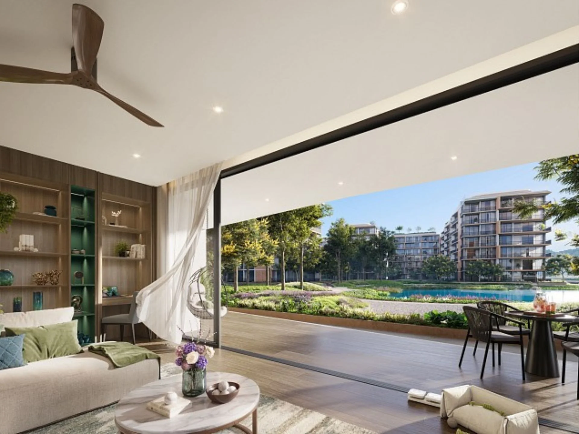 Living room with terrace and lake view in 3-bedroom apartment at Laguna Skypark Elara, Thailand