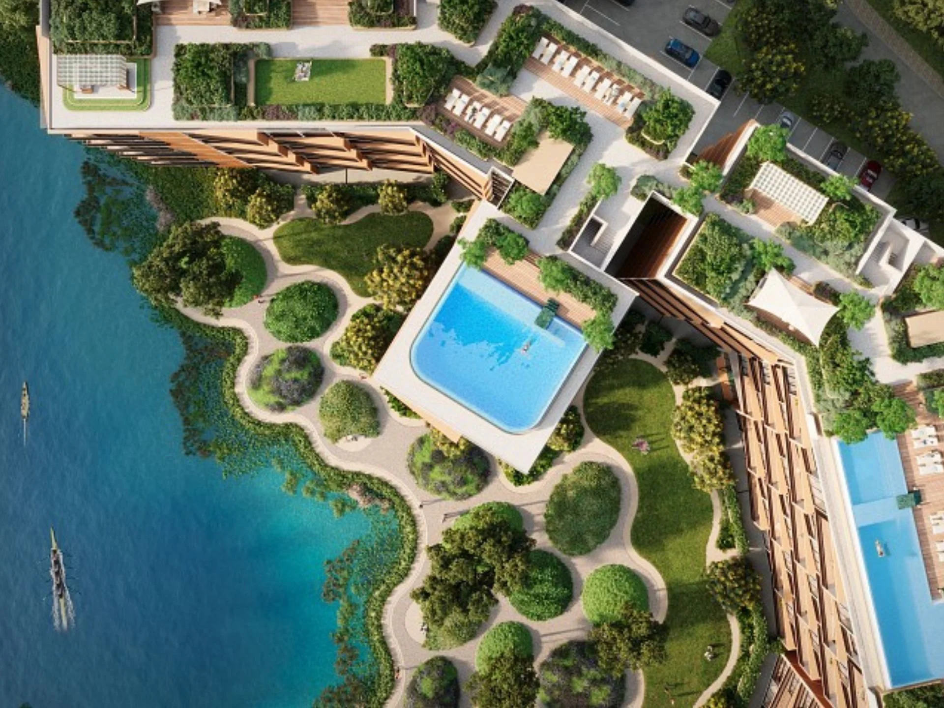Aerial view of Laguna Skypark Elara complex with waterfront landscaping and swimming pool, Thailand