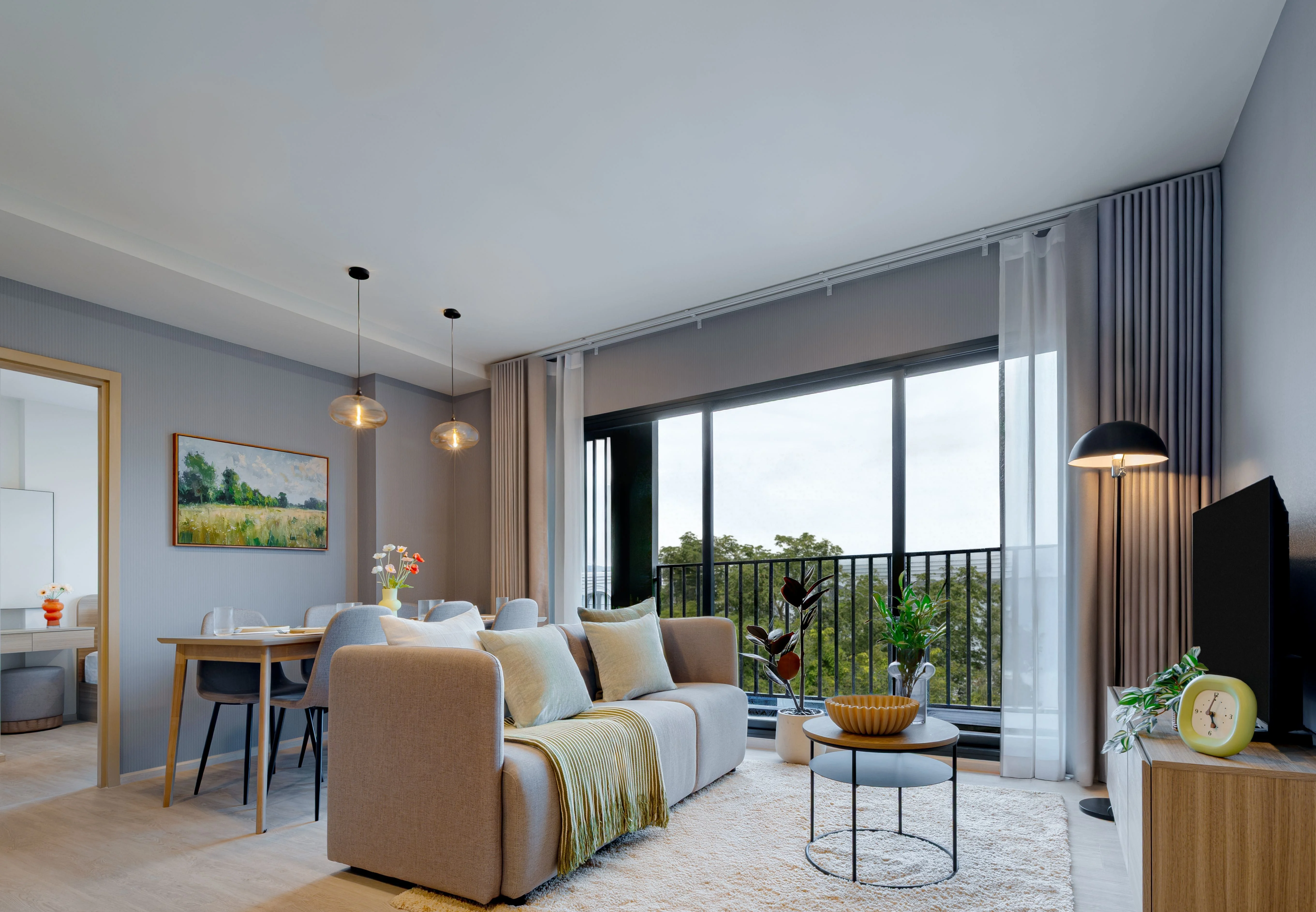 Living room interior with balcony view in 2-bedroom apartment at The Base Cherngtalay, Chengthalay