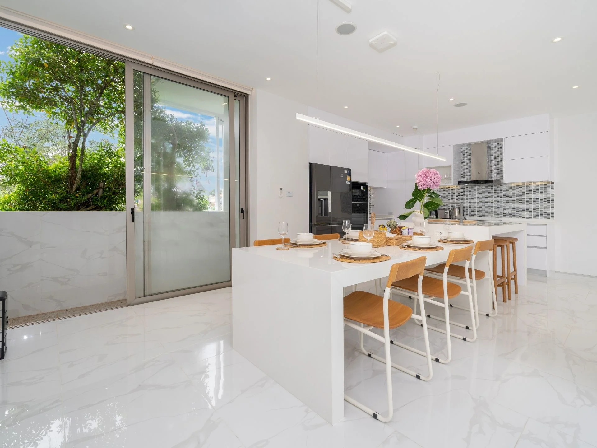 Kitchen and dining area interior in apartment at The Residence, Thailand