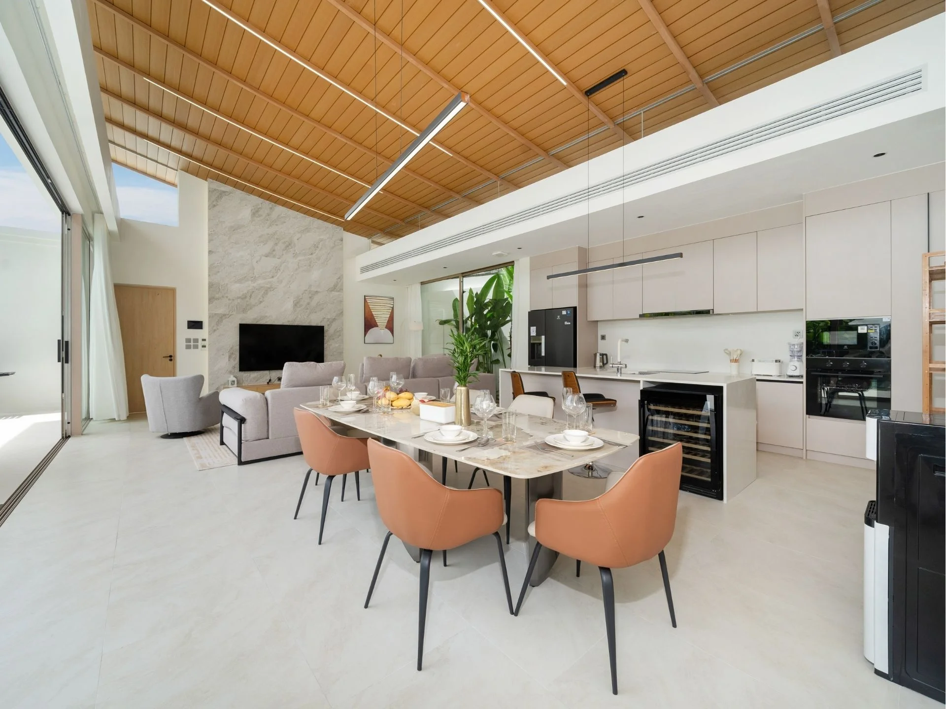 Open-plan living and dining area with kitchen in 3-bedroom villa at The Residence, Bang Tao