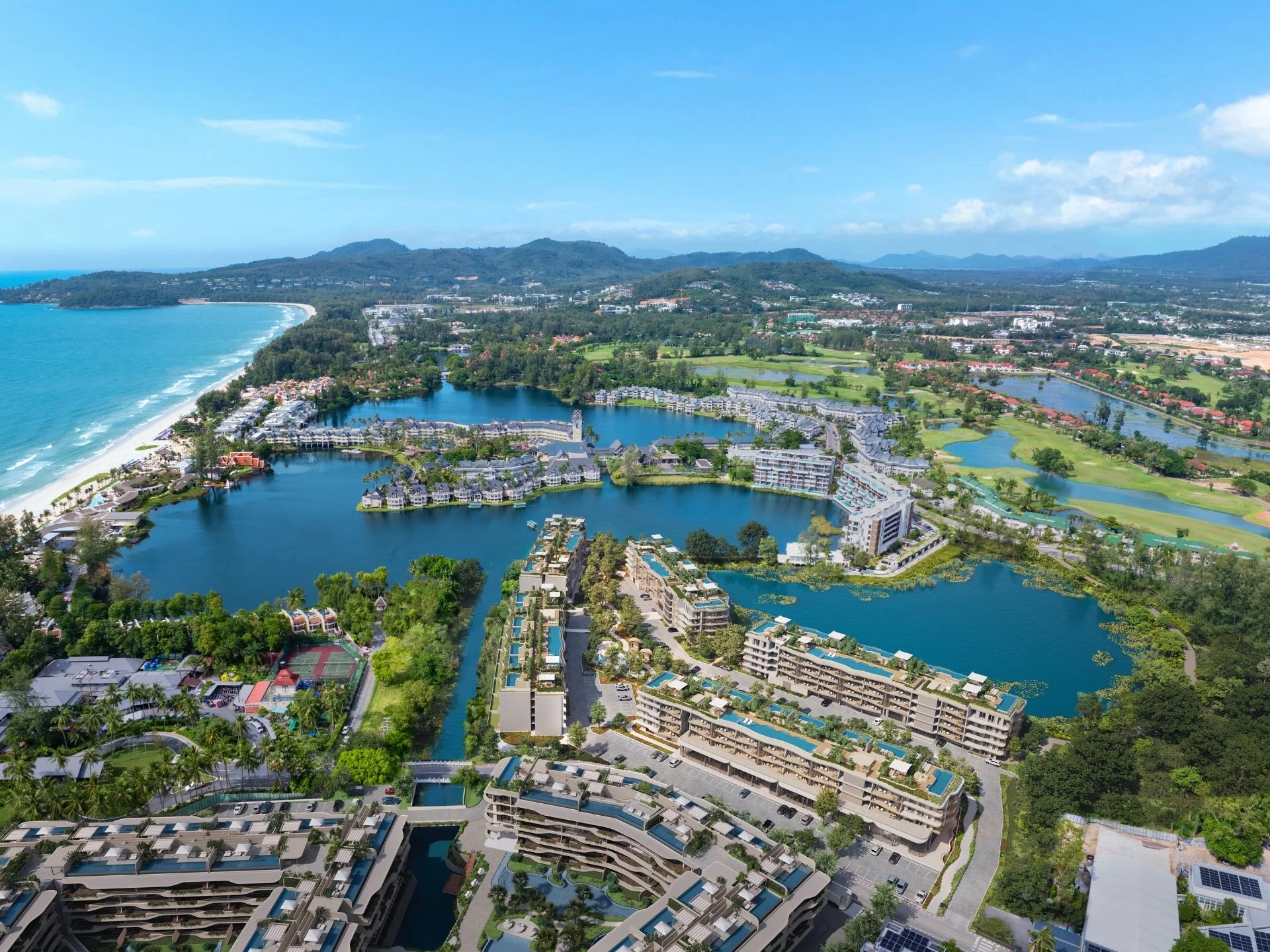 Aerial view of Bellaguna Lake Residences Lotus complex with lagoons and beach, Thailand