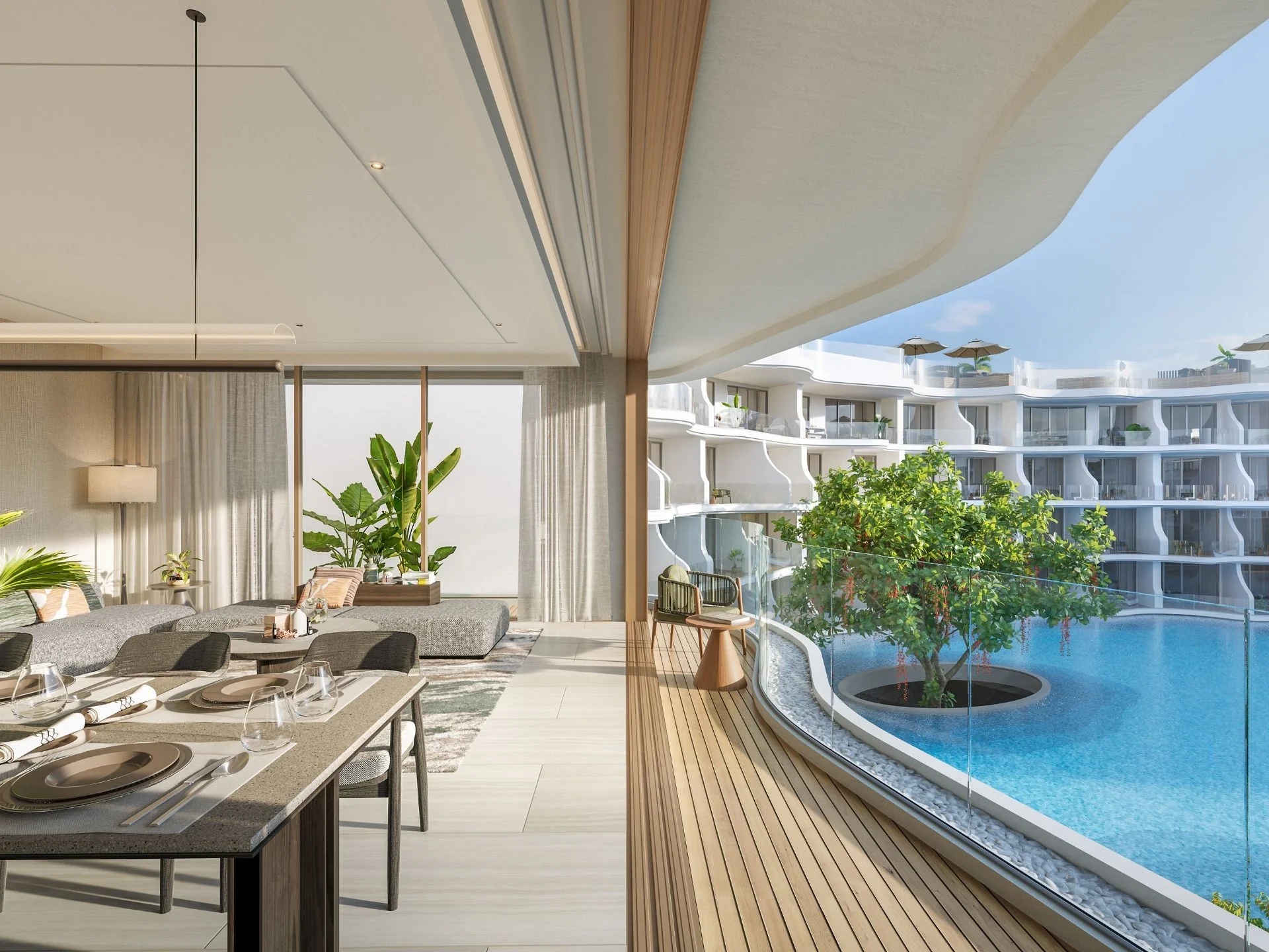Living room and dining area with pool view in 2-bedroom penthouse at Garrya Residences Phuket, Bang Tao