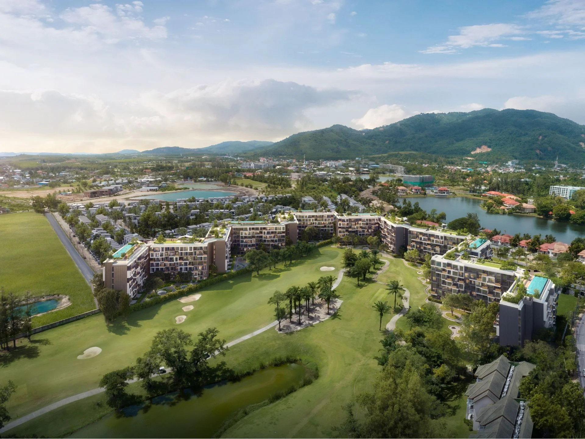 Aerial view of Laguna Skypark Celeste residential complex with golf course and mountain landscape, Thailand