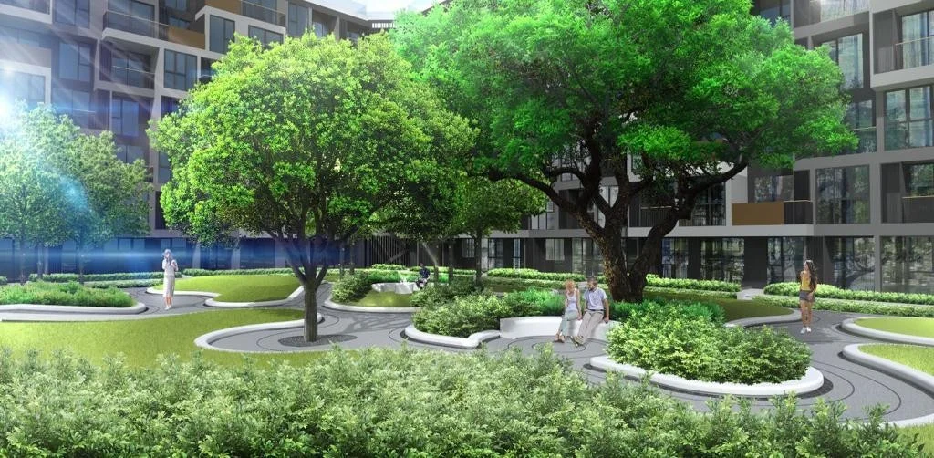 Landscaped courtyard with mature trees at Laguna Skypark Celeste, Thailand