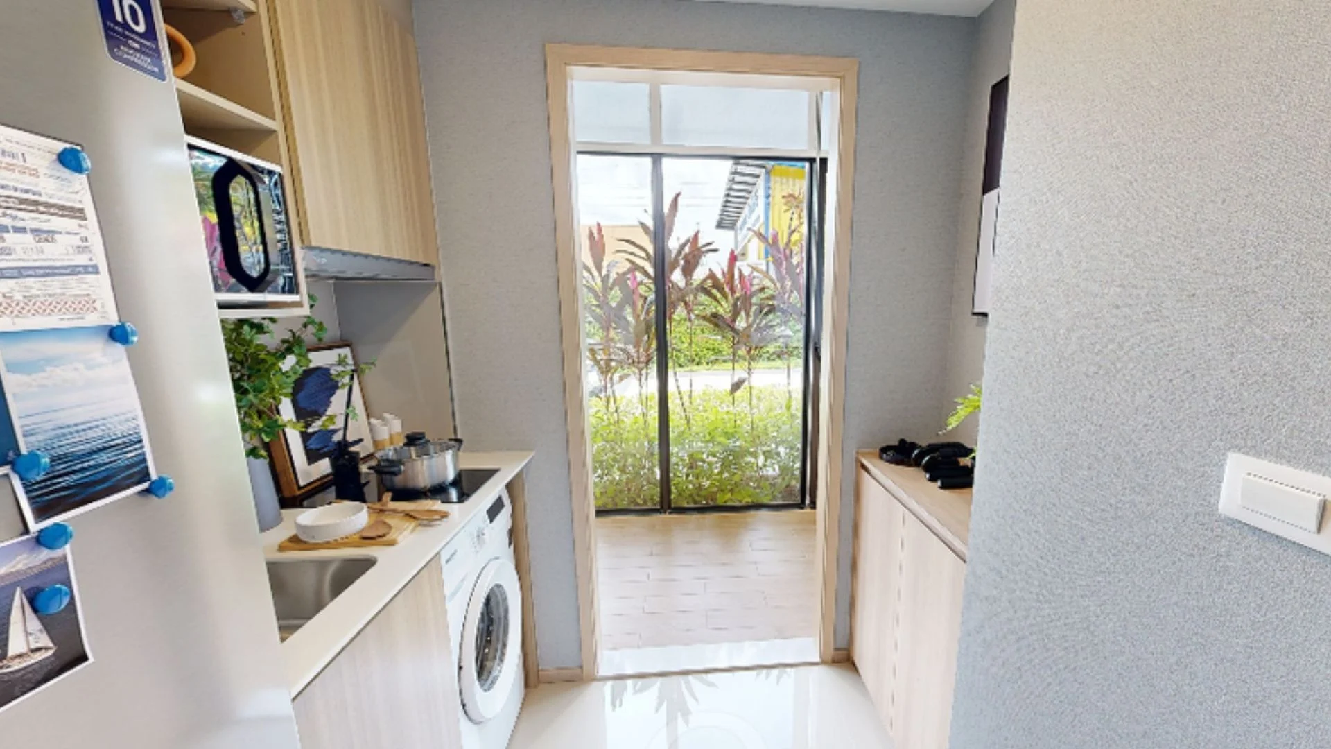 Kitchen interior with garden view in 1-bedroom apartment at The Base Rise, Phuke