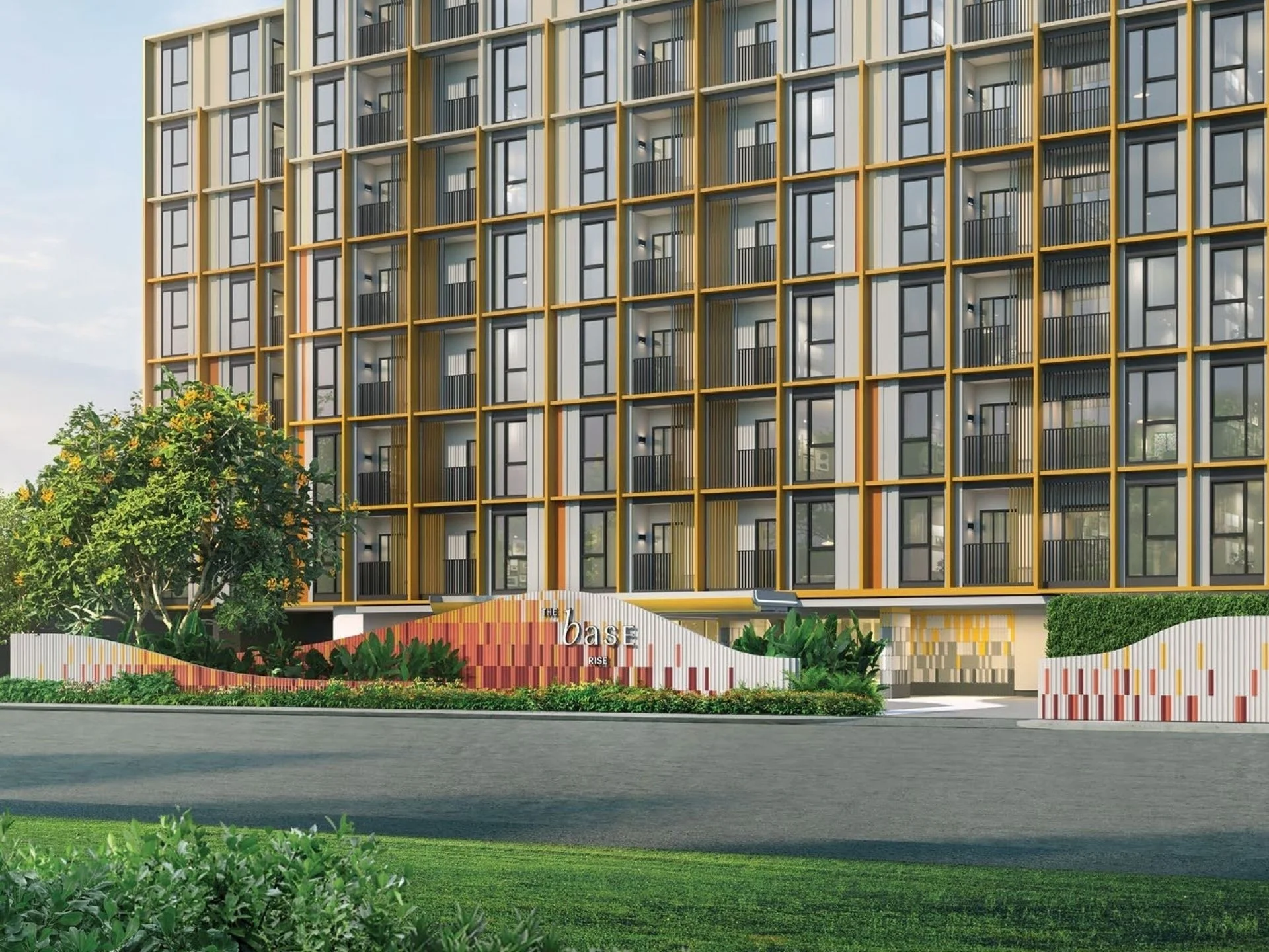 Architecture of The Base Rise apartment complex with golden facade elements, Wichi