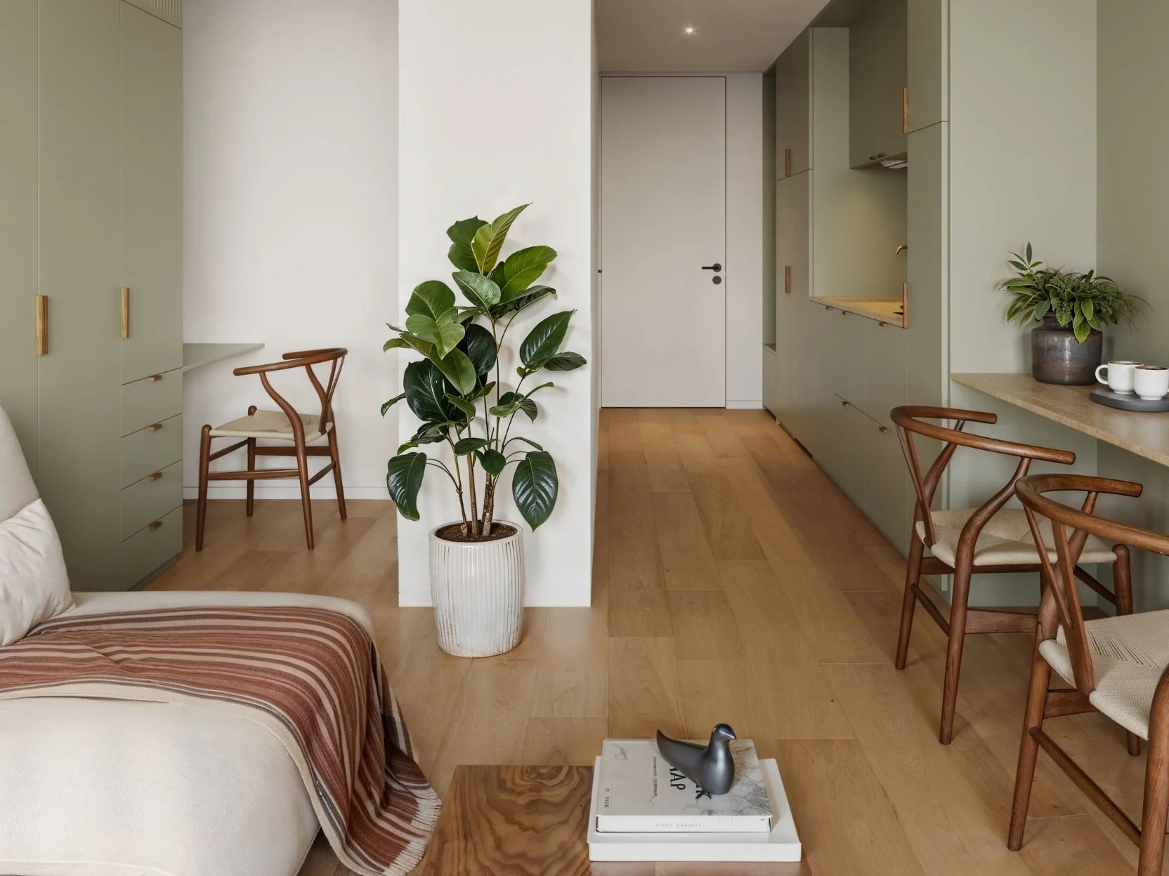 Studio interior with bedroom and workspace at The Momentum Phuket, Laya