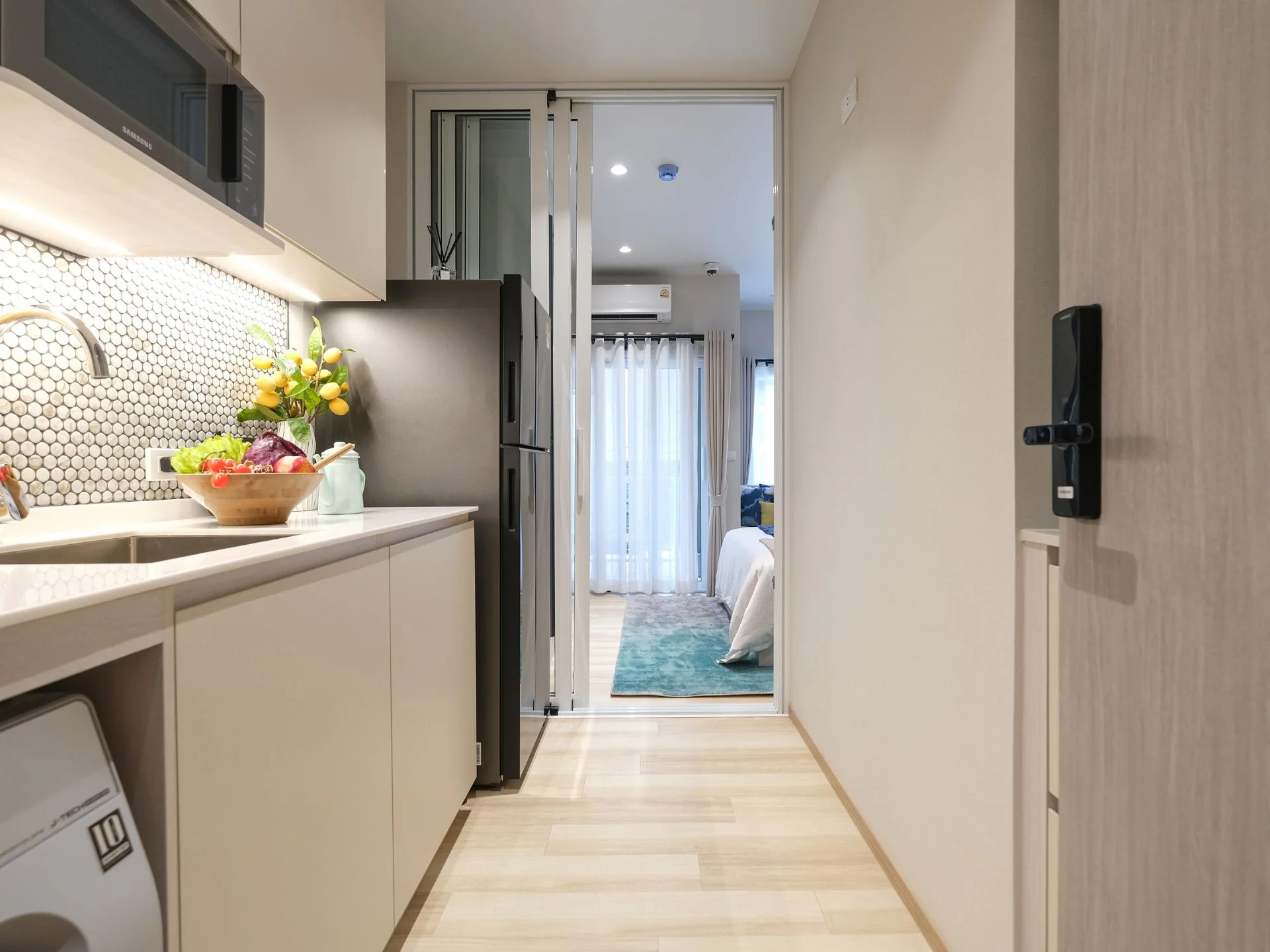 Kitchen interior in a studio apartment at The Title Serenity, Nai Yang