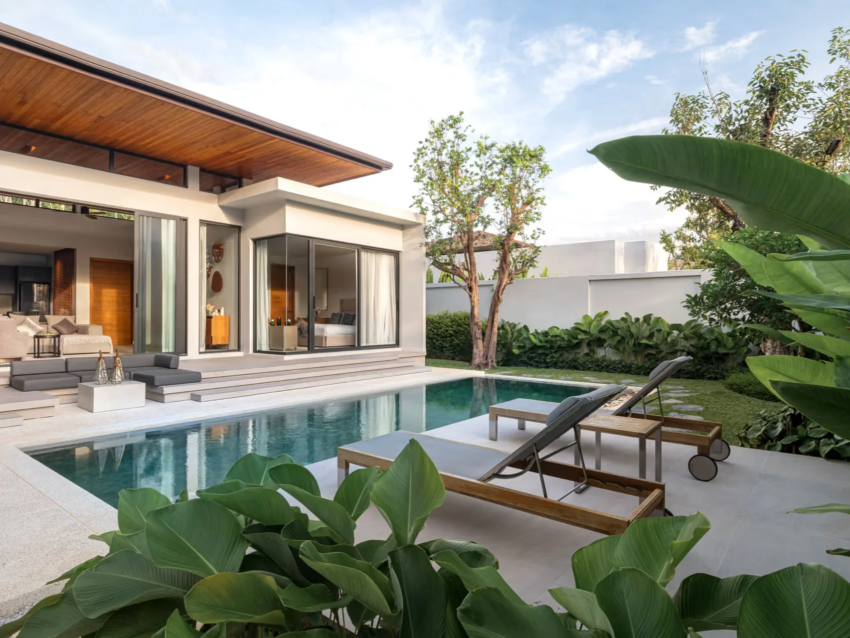 Swimming pool and landscaped terrace at Botanica Four Seasons villa, Thailand
