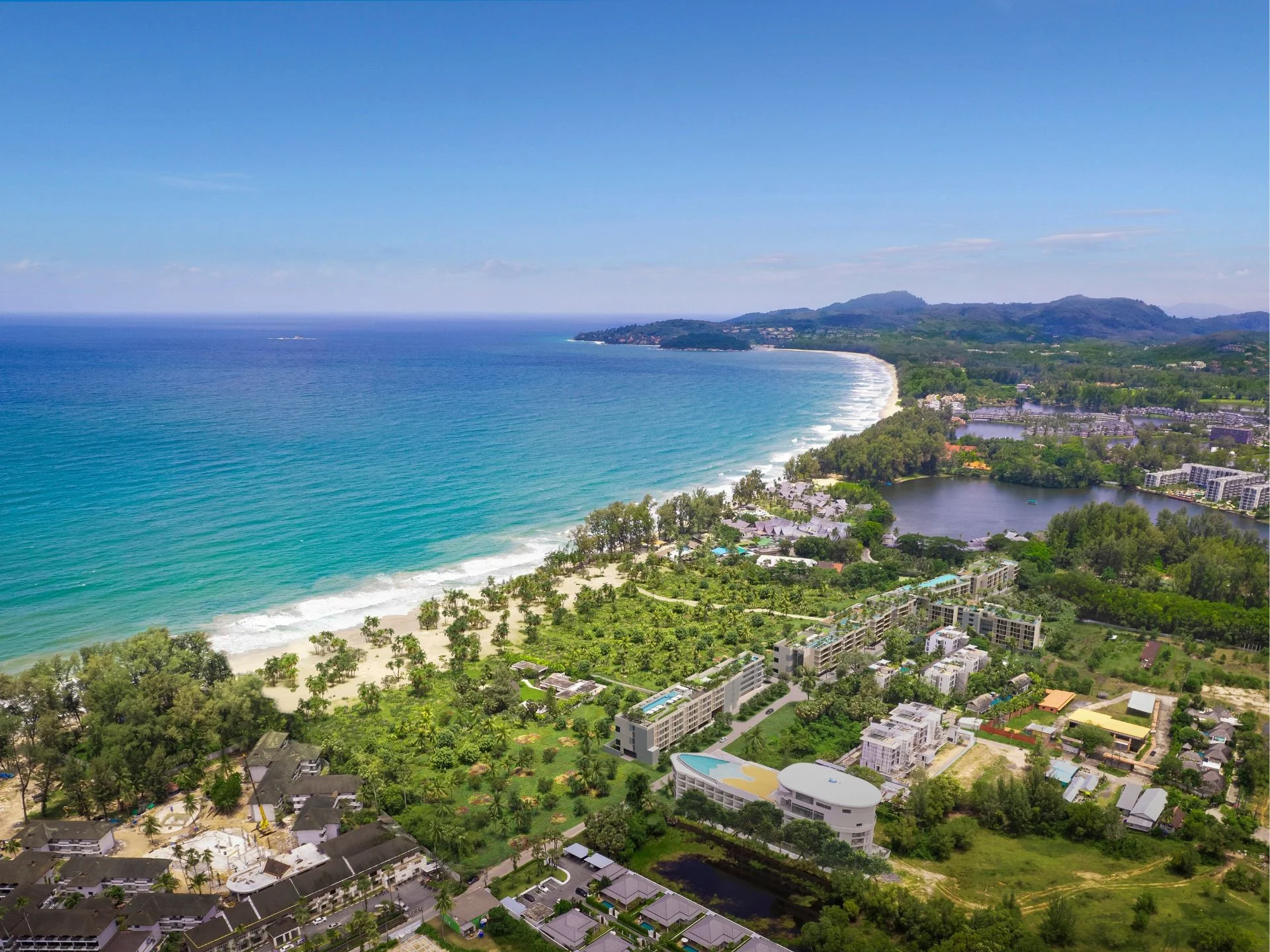 Aerial view of Laguna Beach Residences Seashore complex with beach and lagoon, Bang Tao