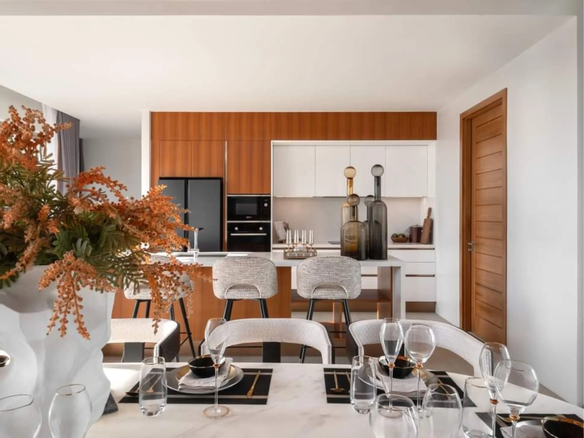 Kitchen and dining area interior in a 3-bedroom villa at Botanica Grand Avenue, Cherng Talay
