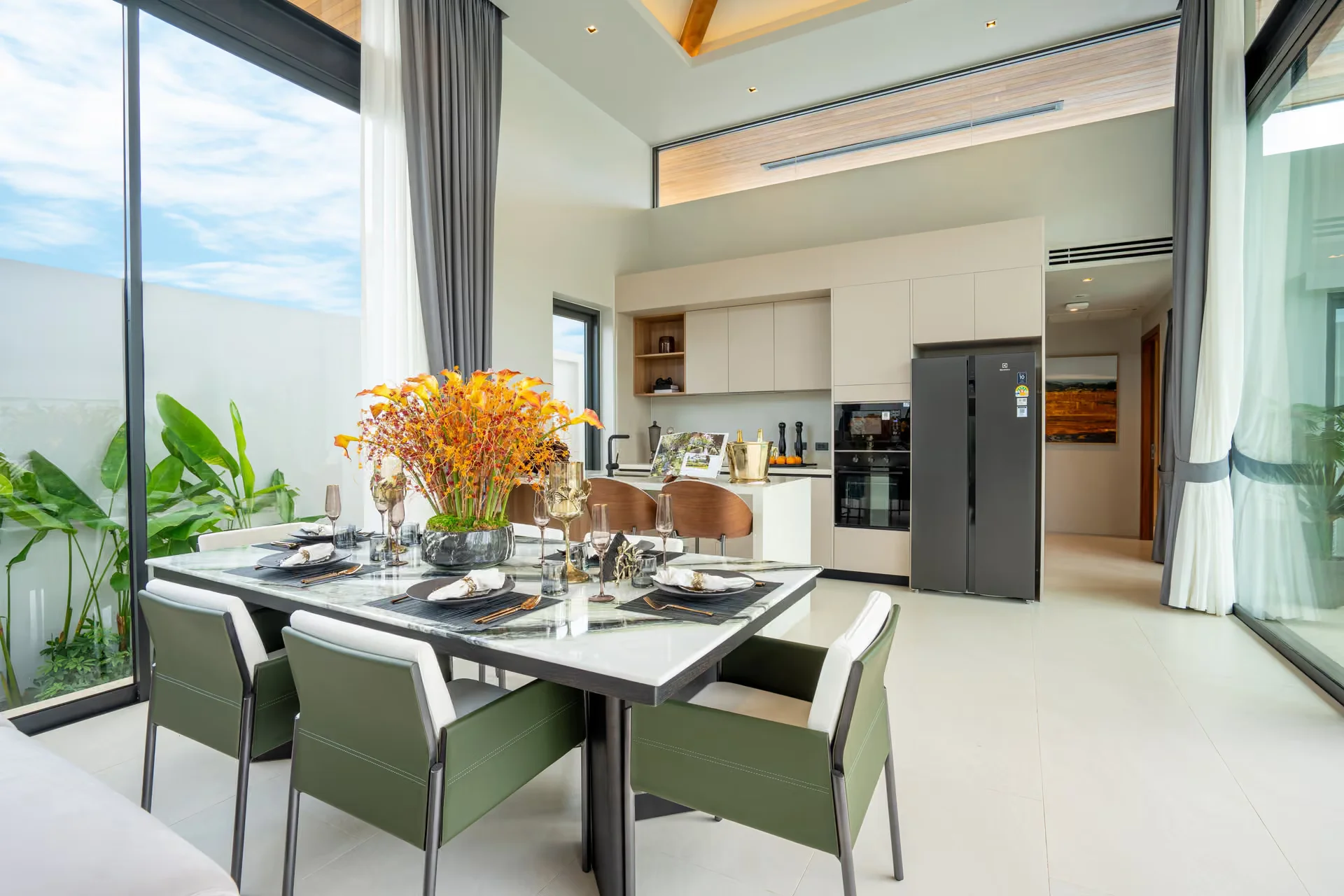 Open-plan dining and kitchen interior in 3-bedroom villa at Botanica Pru Jampa, Talanng