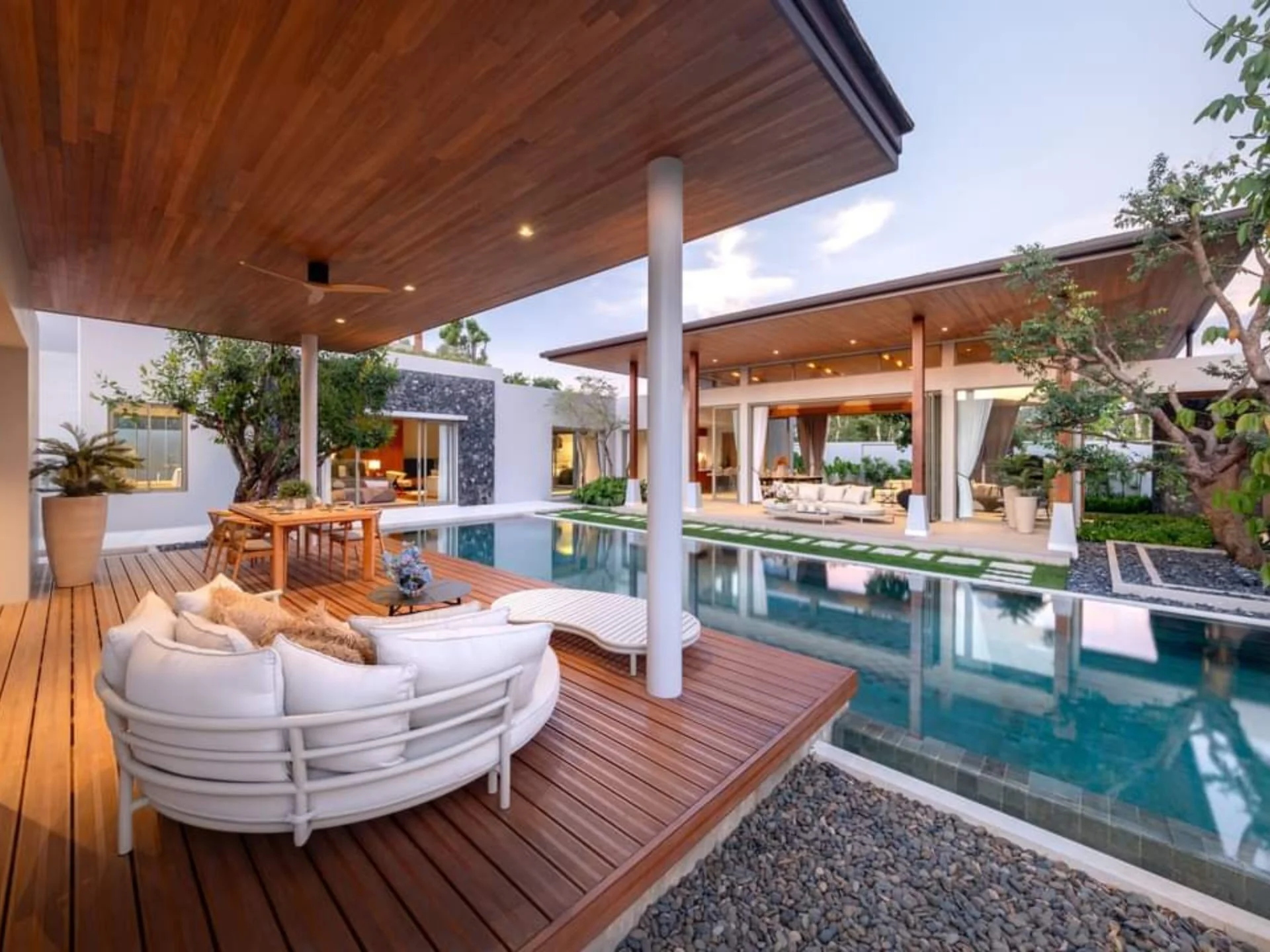 Outdoor terrace with swimming pool and lounge seating at Botanica Grand Avenue villa, Cherng Talay