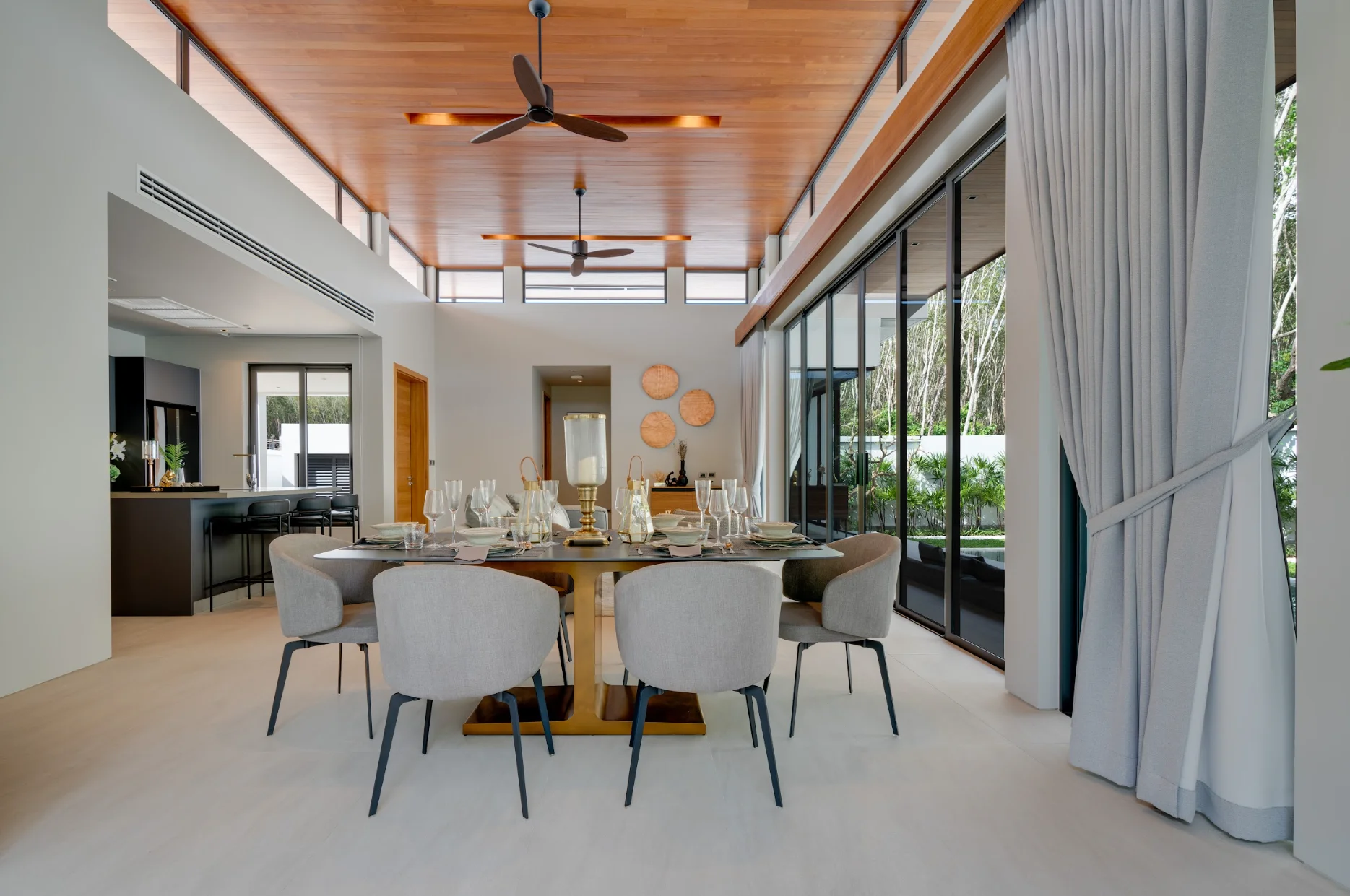 Dining area with wooden ceiling and garden view in 4-bedroom villa at Botanica Four Seasons, Laya