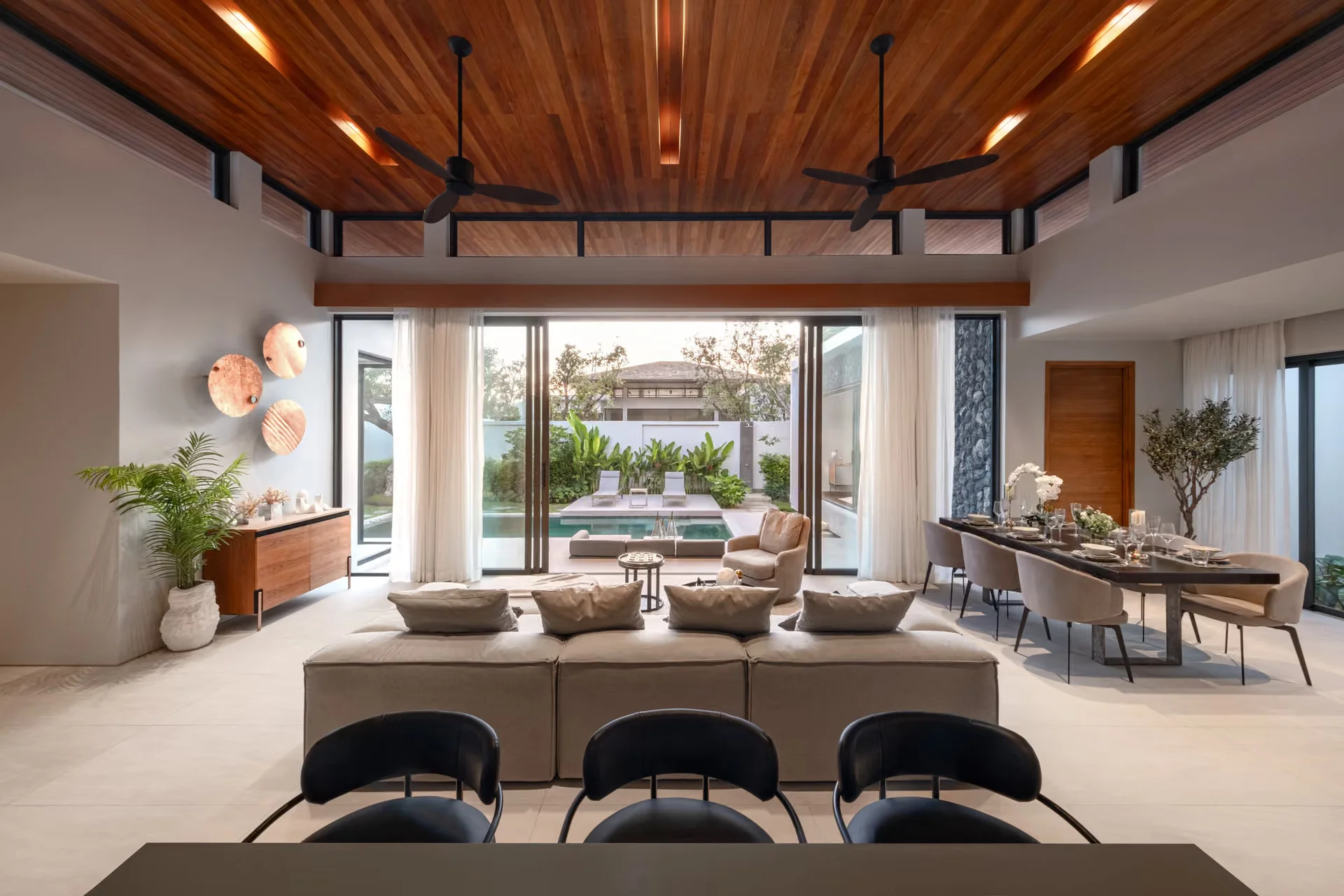 Living room interior with pool view in 4-bedroom villa at Botanica Four Seasons, Laya
