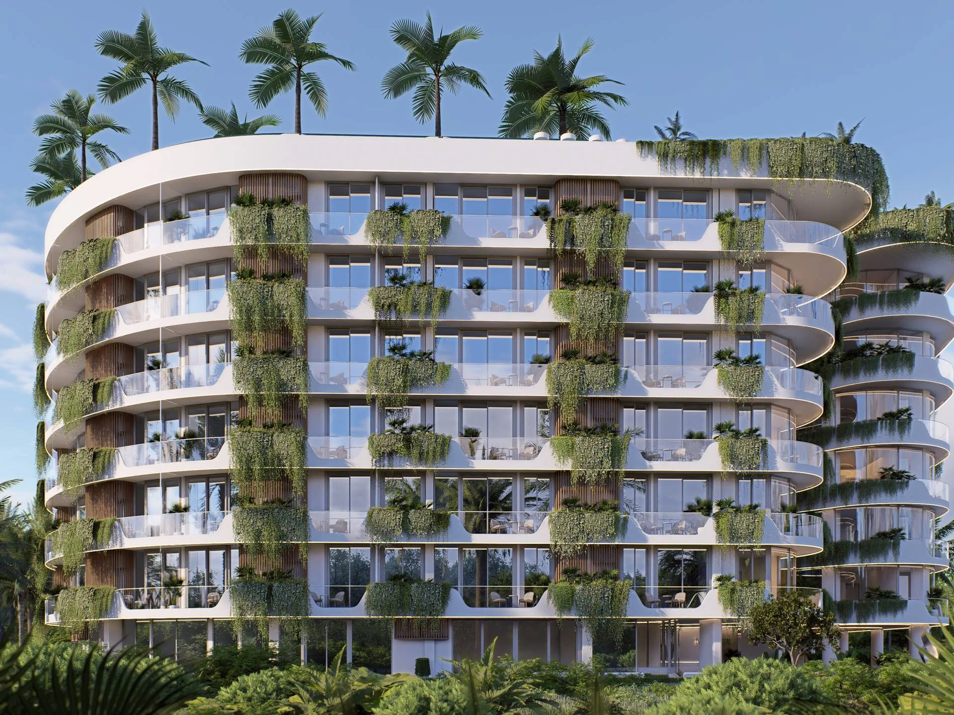 Modern residential architecture with vertical green walls and curved balconies at Millennium, Bang Tao