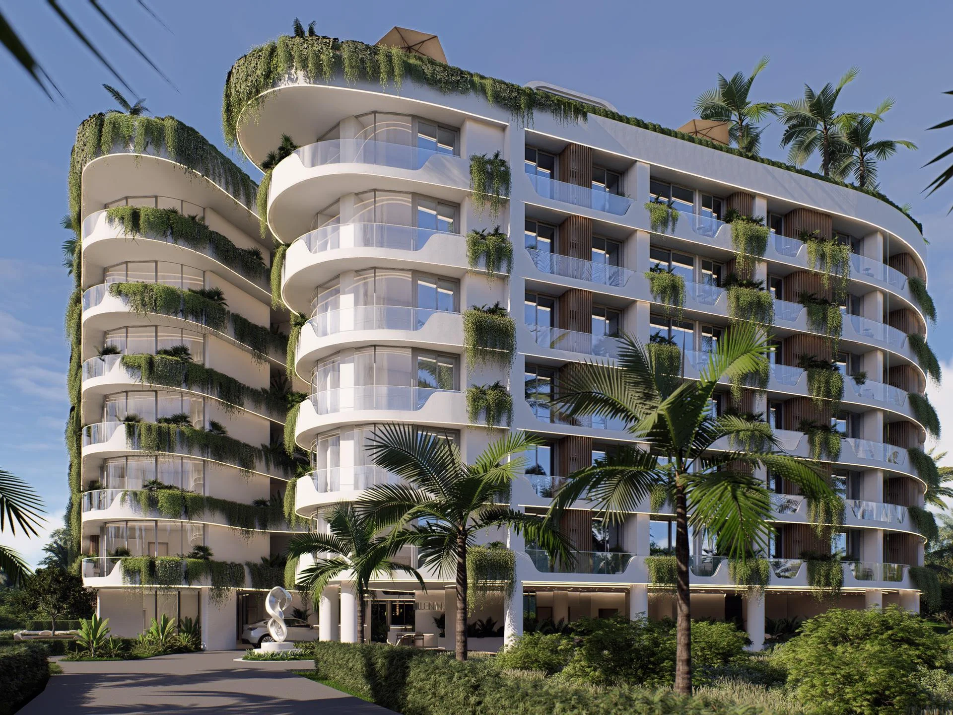 Modern residential architecture with green terraces and curved balconies at Millennium, Bang Tao