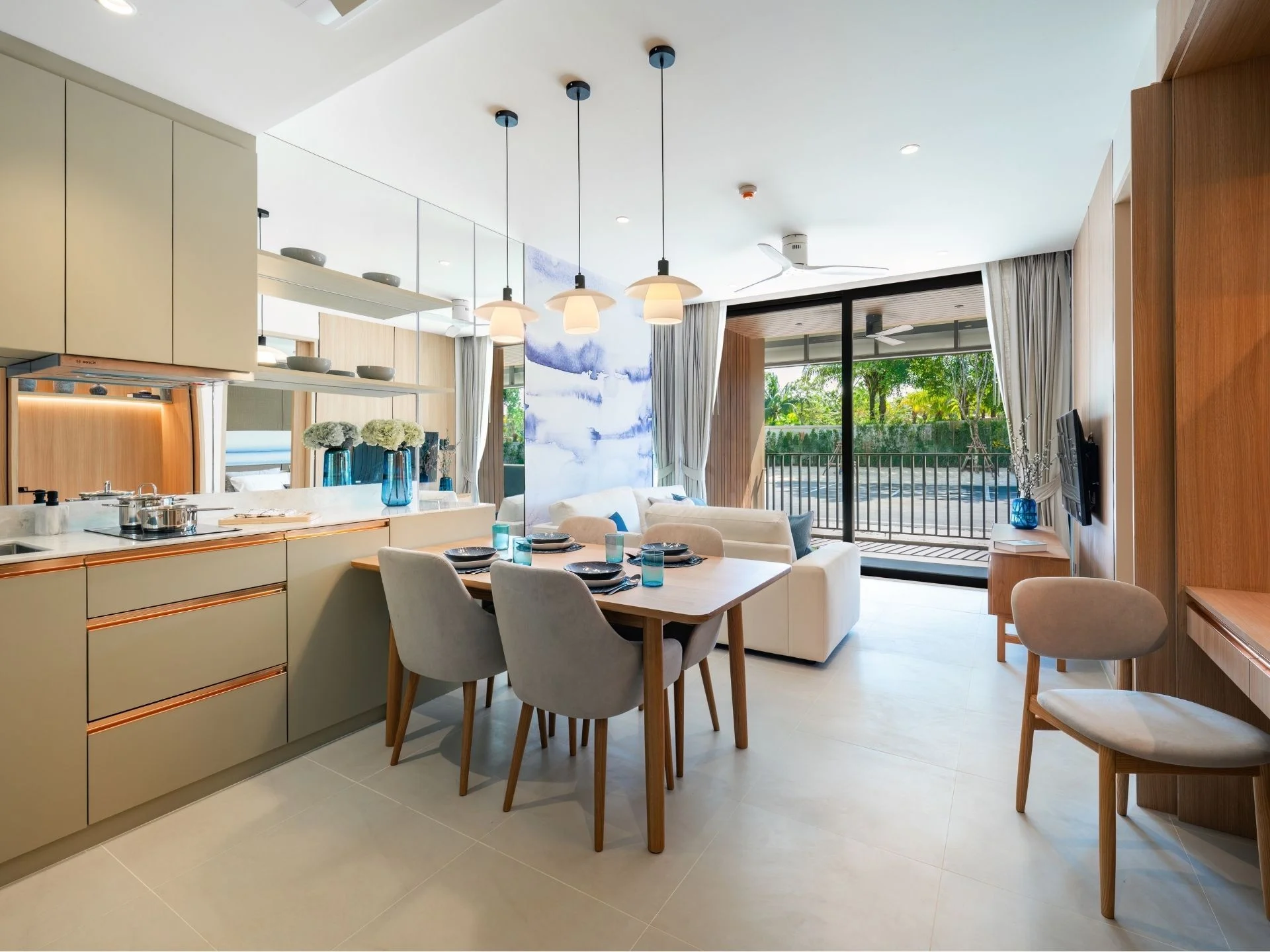 Open-plan kitchen and dining area interior in a 3-bedroom apartment at Laguna Lakelands Waterside Residences, Laguna