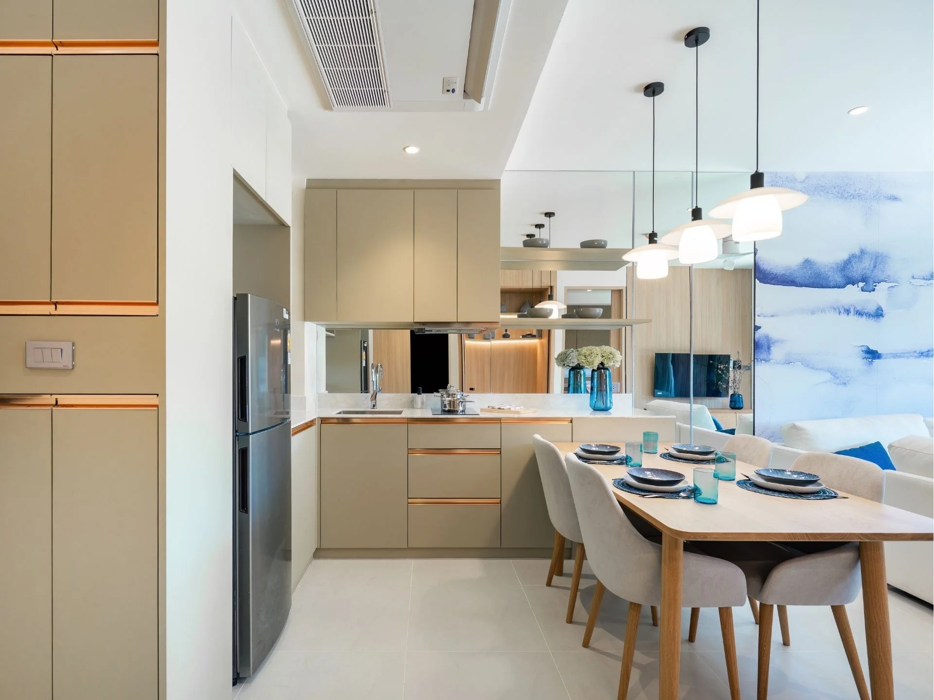 Kitchen and dining area interior in a 3-bedroom apartment at Laguna Lakelands Waterside Residences, Laguna, Thailand