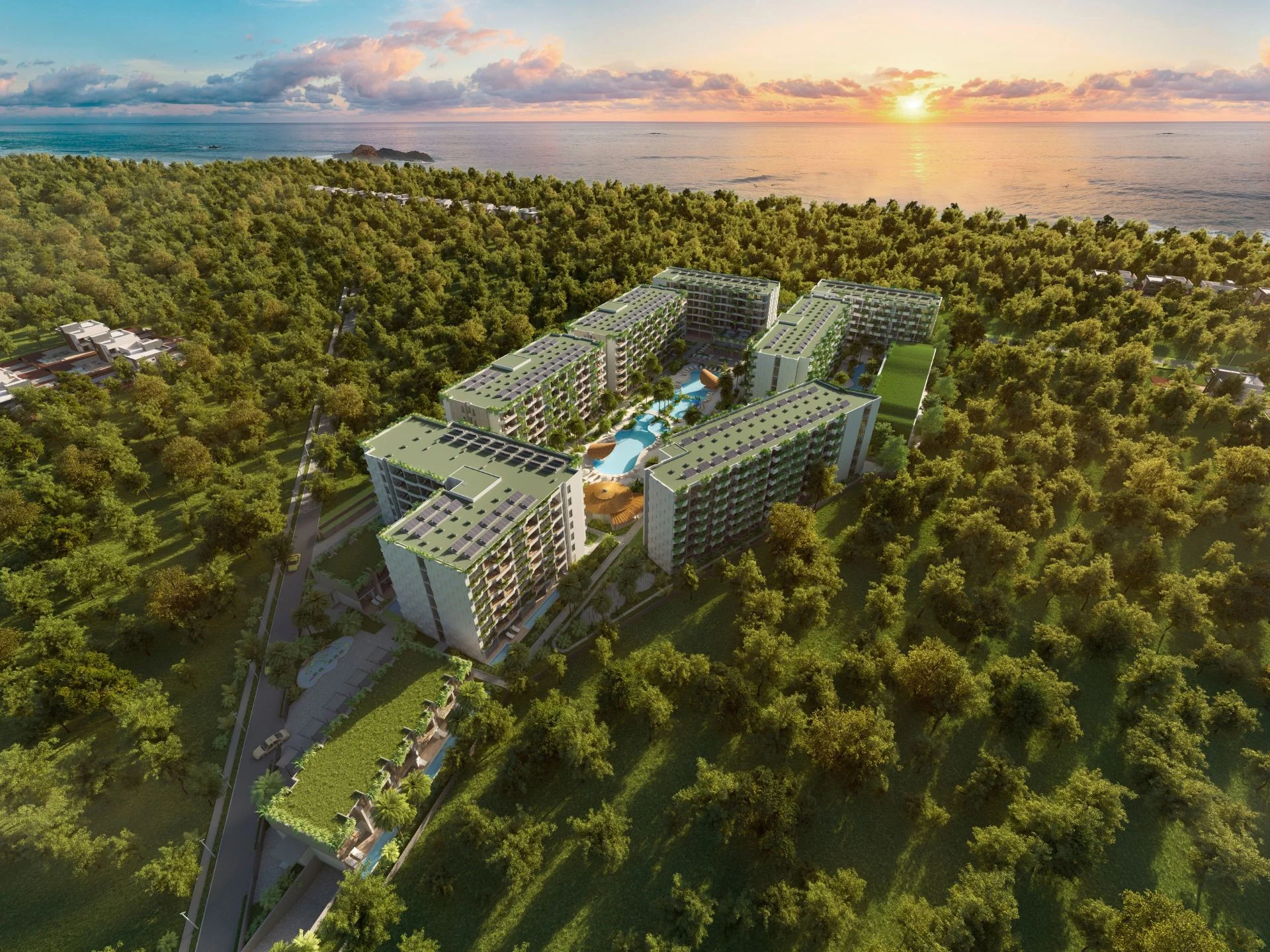 Aerial view of Layan Green Park Phase 2 complex buildings near the sea at sunset, Layan, Thailand