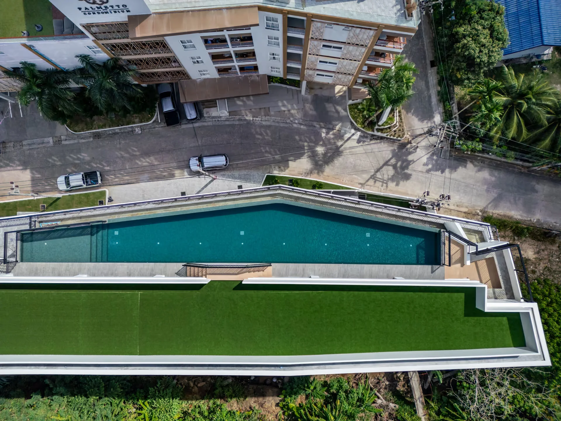 Aerial view of the swimming pool and turf deck at Palmetto Park, Karon, Thailand