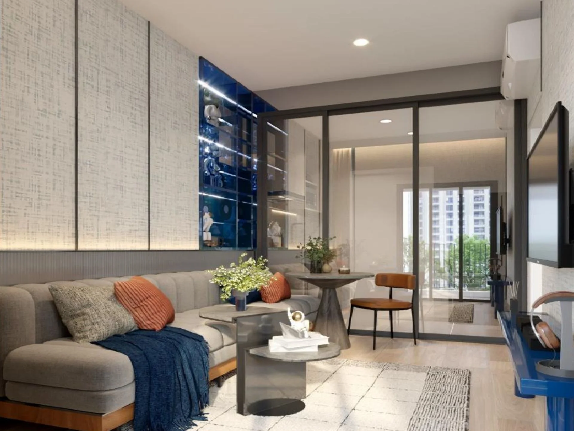Living room interior with grey sofa and balcony view in a 2-bedroom apartment at XELF by Sansiri, Khlong Tan, Thailand