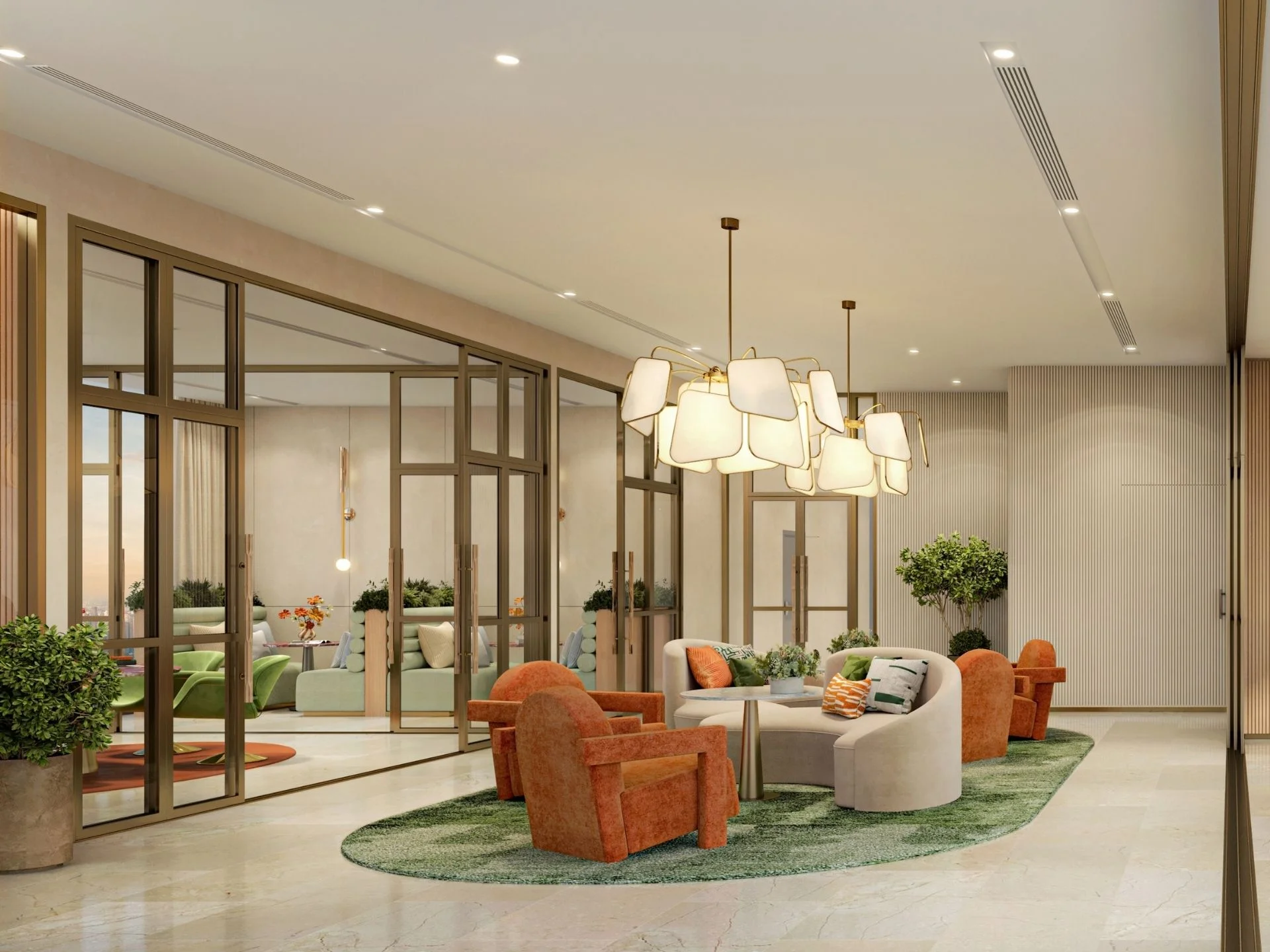 Lounge area with orange armchairs, curved sofa and green rug at XELF complex, Thailand