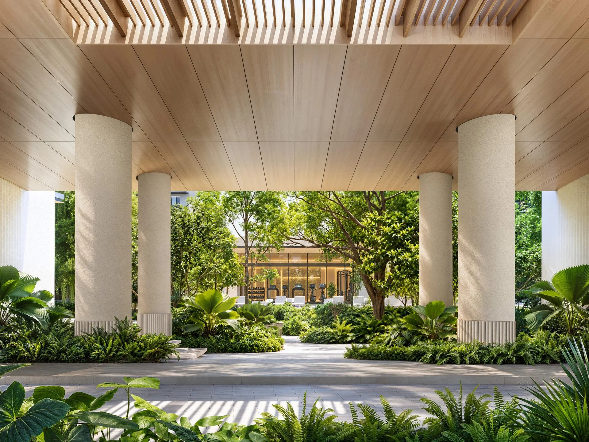 Covered colonnade with wooden ceiling and landscaped garden at Purita, Thailand, gym visible beyond