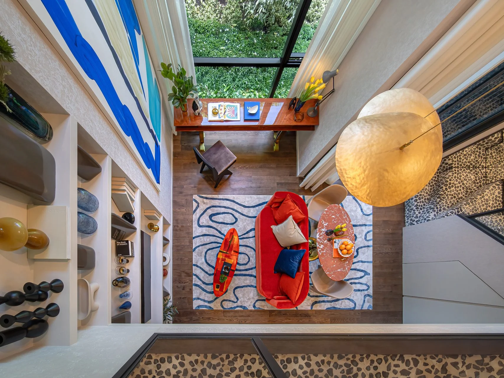 Living room with red sofa and blue rug in 1-bedroom loft at SHUSH Ratchathewi, Ratchathewi, Thailand