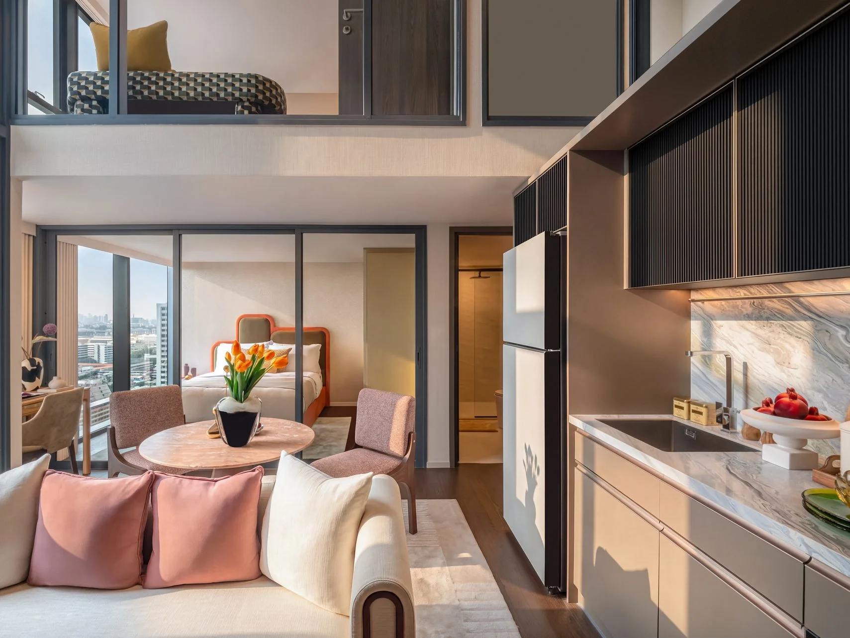 Living room interior in a loft apartment at SHUSH Ratchathewi, Thailand, with kitchen, bedroom and city view