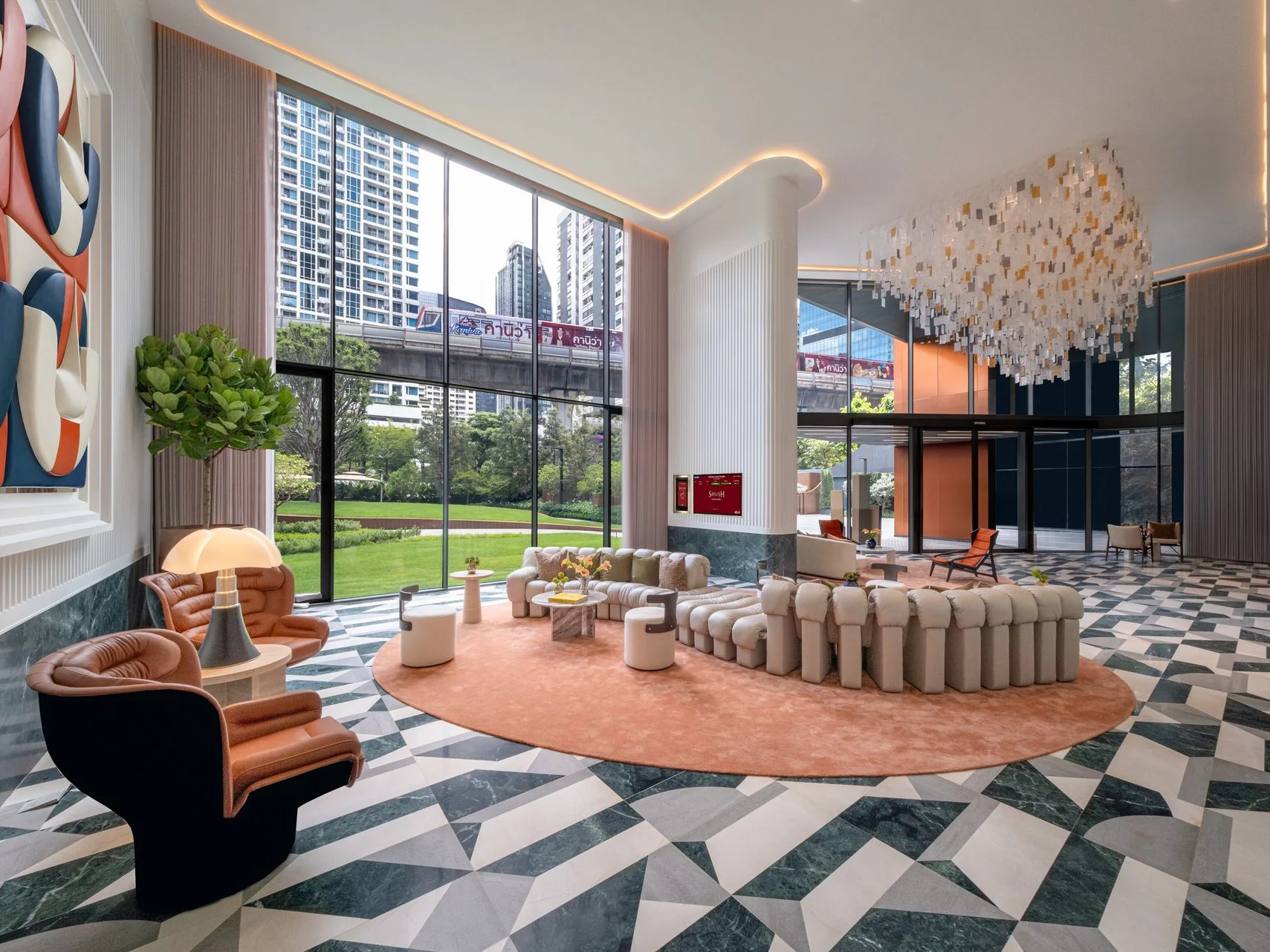 Lobby lounge with modular sofas, terracotta rug and marble floor at SHUSH Ratchathewi, Thailand