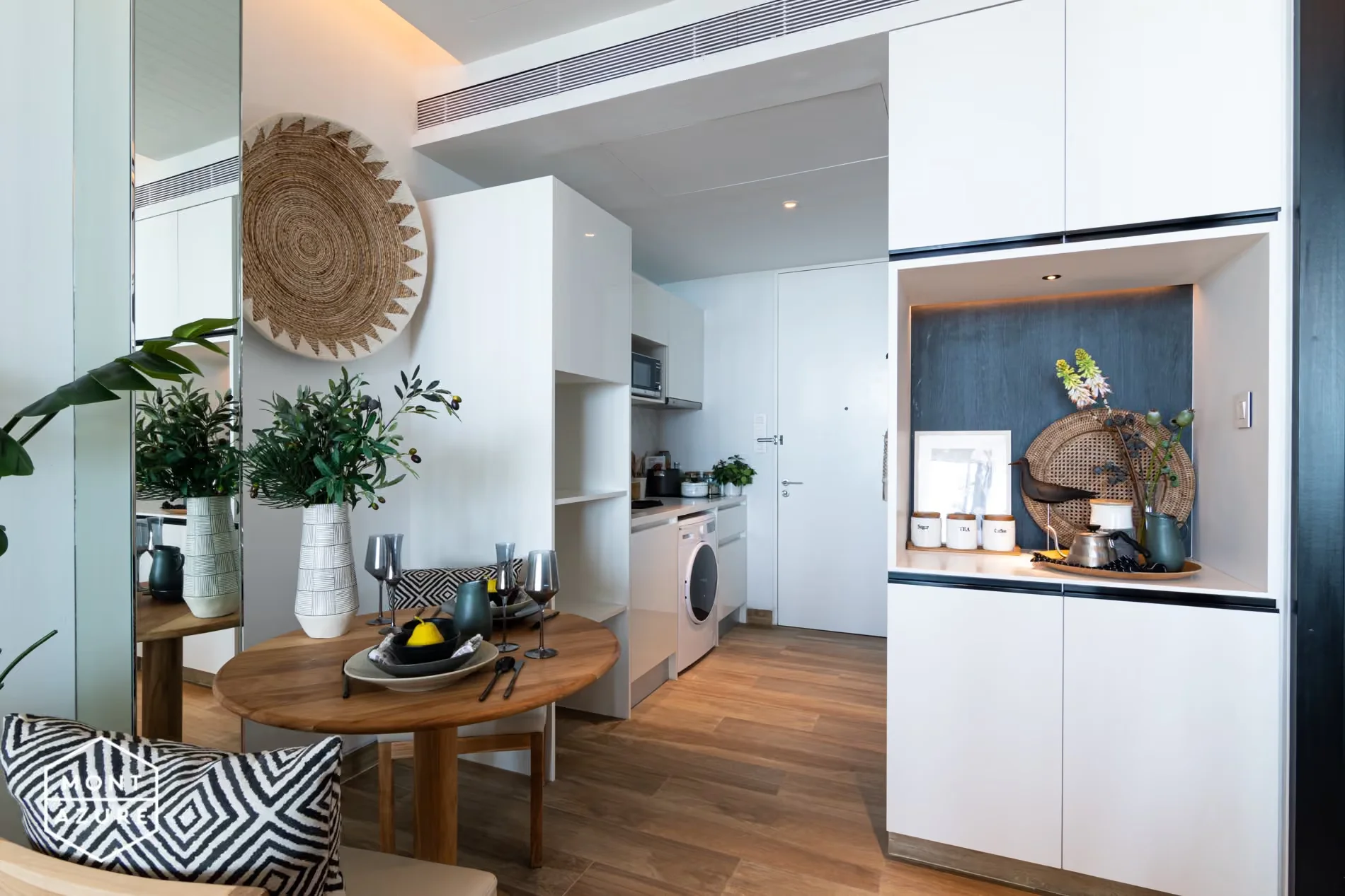 Dining area and kitchenette interior in a 1-bedroom apartment at MGallery Residences MontAzure, Kamala, Thailand