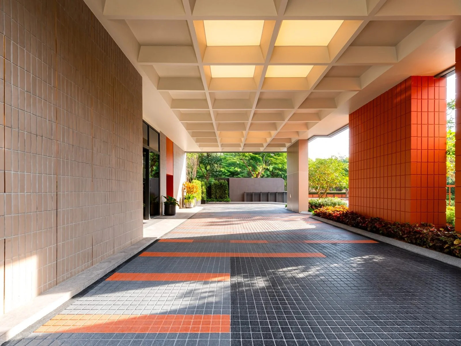Architecture of FLO by Sansiri, covered entrance walkway with tiled floor and coffered ceiling, Thailand
