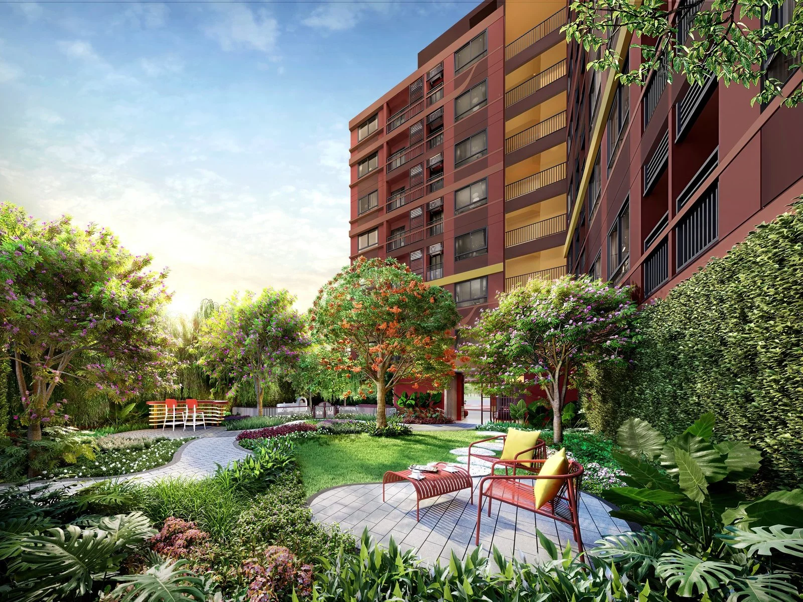 Landscaped courtyard garden with lounge chairs and tropical trees at The Muve Sukhumvit 107, Bangna, Thailand
