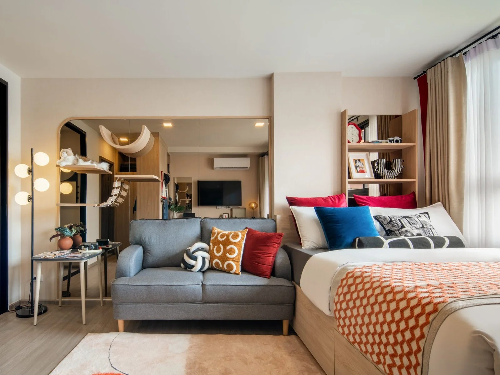 Studio-style living room and bed interior in a 1-bedroom apartment at The Muve Sukhumvit 107, Bangna, Thailand