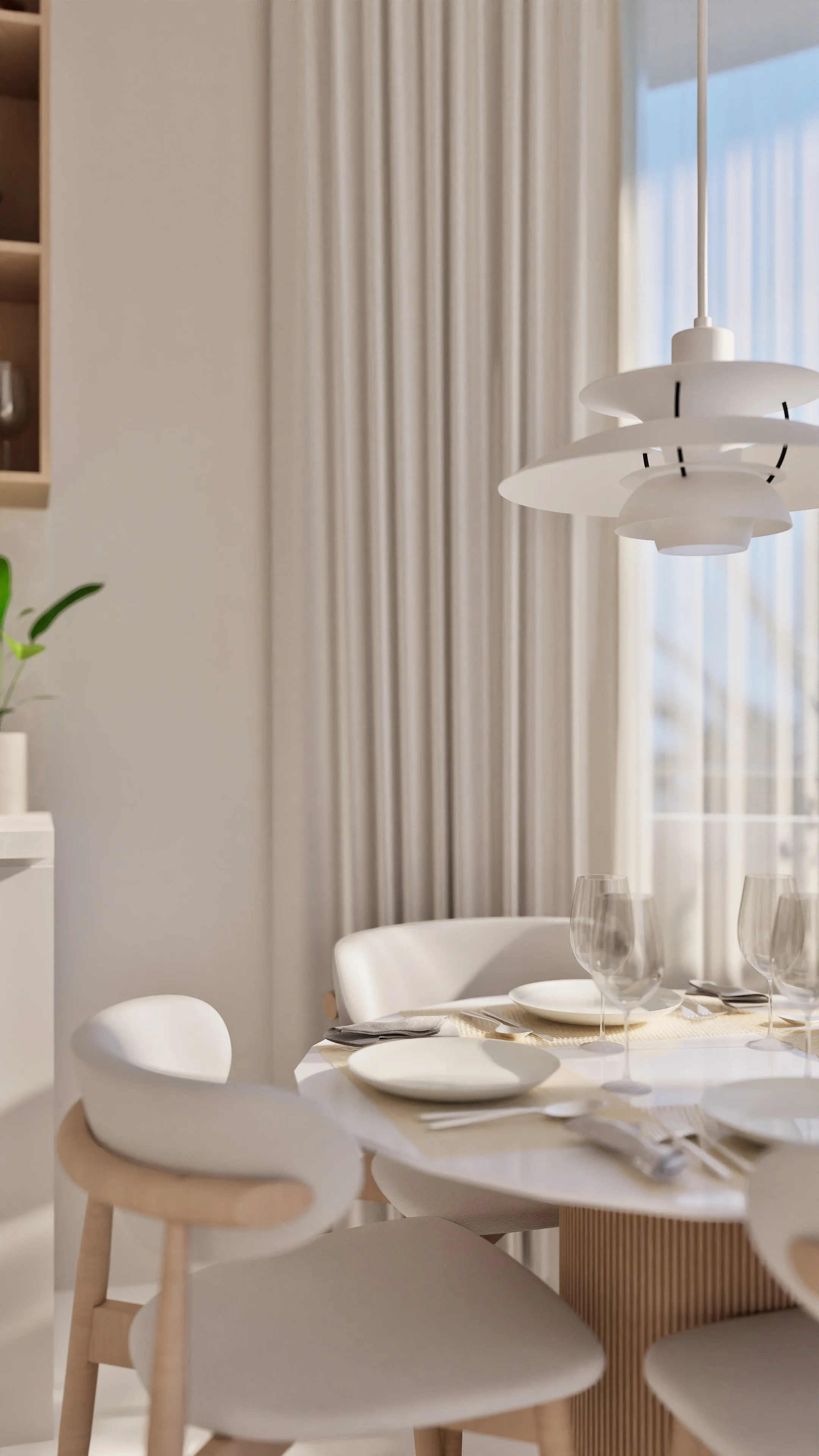 Dining area interior with round table and white pendant lamp in a 1-bedroom apartment at Millennium, Bang Tao, Thailand